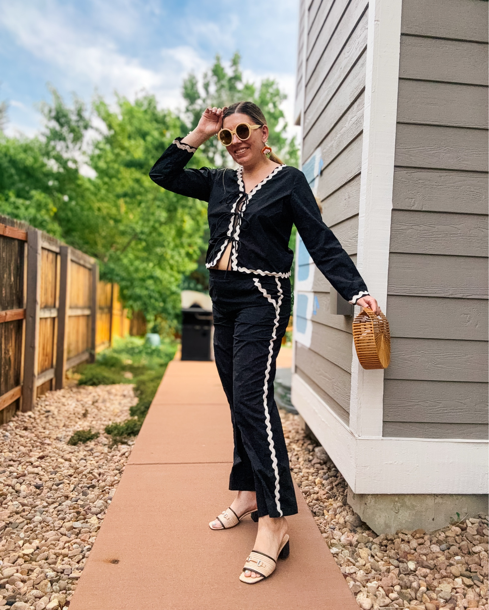 Look 6
Main Street Muse
A curated style series

This set checks all the boxes for me:  rickrack trim ✔️, tie-front closure ✔️, breezy silhouette ✔️. It feels so effortless and summery, but the black-and-white palette makes it extra chic—and perfect for late summer when you want easy pieces that still look pulled together.

I love how these details feel fresh and on-trend, but also a little retro in the best way. It’s the kind of look I know I’ll reach for again and again because it’s just fun to wear.

🌻 About this capsule:
Each of my capsule collections is a two-week style journey built around a theme. Main Street Muse is all about savoring summer’s final moments while embracing the first hints of fall - colorful, romantic, and filled with nostalgic charm. 

Top & Pants- Resumé (available for rent on Nuuly - coupon below!)
Earrings - Le chic Miami (linked)
Sunglasses - Gucci (linked)
Bag - Cult Gaia (linked)
Shoes - Steve Madden (similar linked)
Bracelet - Rocksbox (similar linked)

Get $30 off of your first month of Nuuly! Rent this adorable set!
https://share.nuuly.com/kat42828

#MainStreetMuse #CapsuleCollection #RickrackDetail #TieFrontTop #MatchingSet #SummerStyleInspo #LateSummerStyle #RetroInspiredStyle #ChicAndPlayful #WearableStyle #SeasonalStyle #MainStreetStyle #EclecticStyle #FashionStorytelling #LTKstyle #LTKfashion

#LTKSaleAlert #LTKSeasonal #LTKFindsUnder100