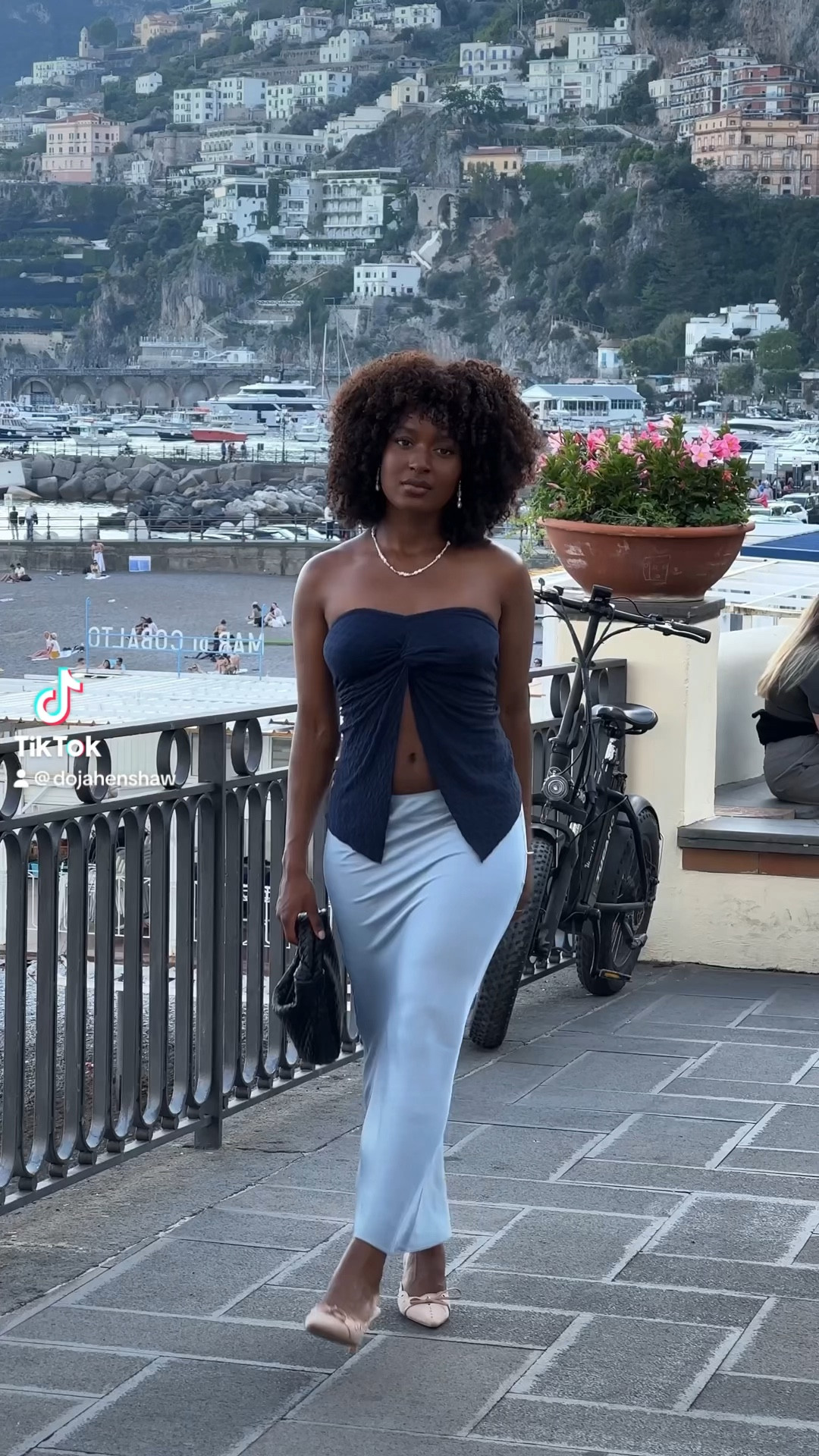blue silk matching outfit crop top bandeau maxi skirt bottega bag kitten heels pointy eurosummer outfit beach date night evening pastel afro hair 

#LTKstyletip #LTKSeasonal #LTKeurope
