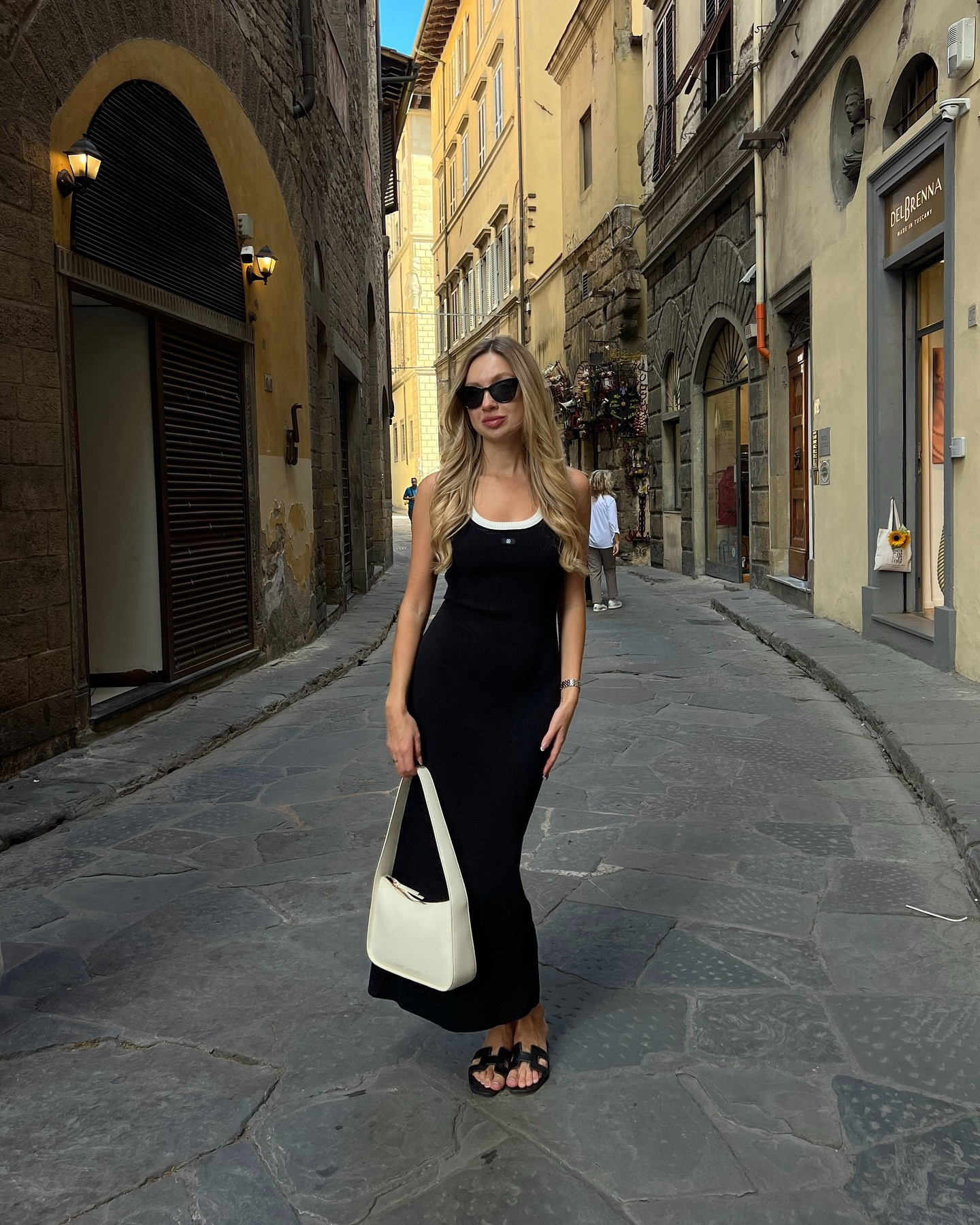 probably last summer outfits in europe this season!🌞 but how I love this dress!! @dissh 

#dissh #disshdress #femininestyle #femininefashion #florencestyle #florencefashion #florenceinfluencer #florenceblogger #florenceitaly 

girl long black dress outfit ideas hermes orange sandals white bag florence italy feminine style
