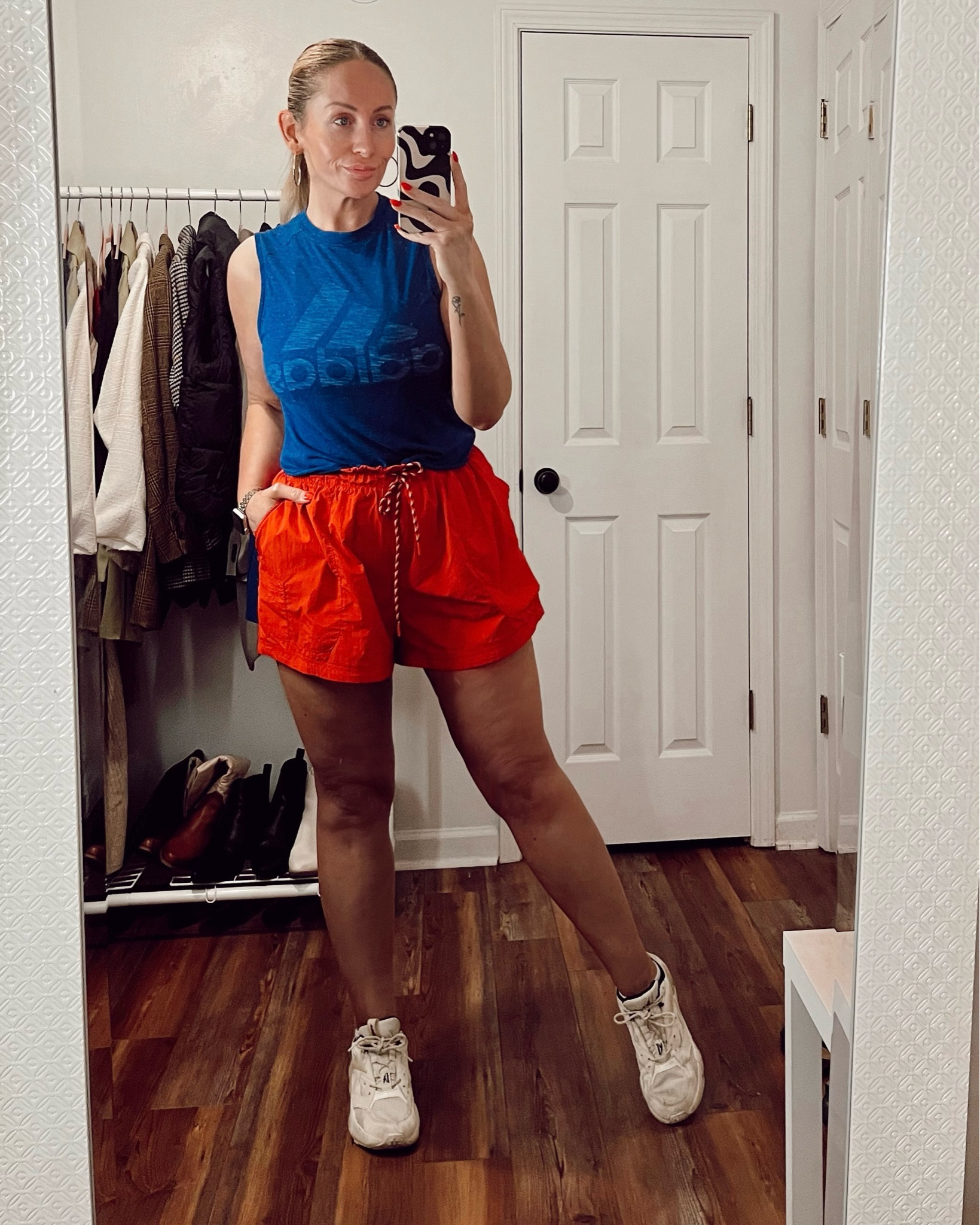 Red running shorts and a blue adidas tank. 
.
.
.
#runningshorts #activewear #midsizestyle #midsizefashion #weekendwear 

#LTKmidsize #LTKFitness #LTKcurves