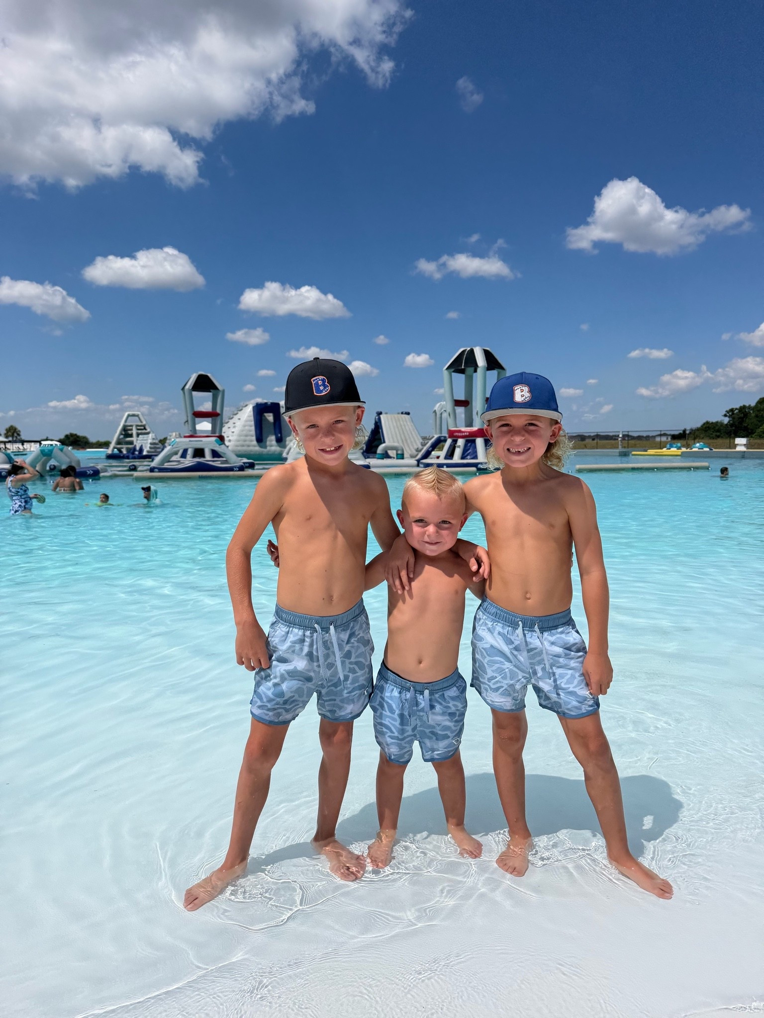 Bray is wearing a 4T, Brody is wearing an XS and Luke is in a small