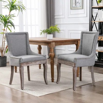 Ultra Side Dining Chair,Thickened fabric chairs with neutrally toned solid wood legs, Bronze nail head | Wayfair North America