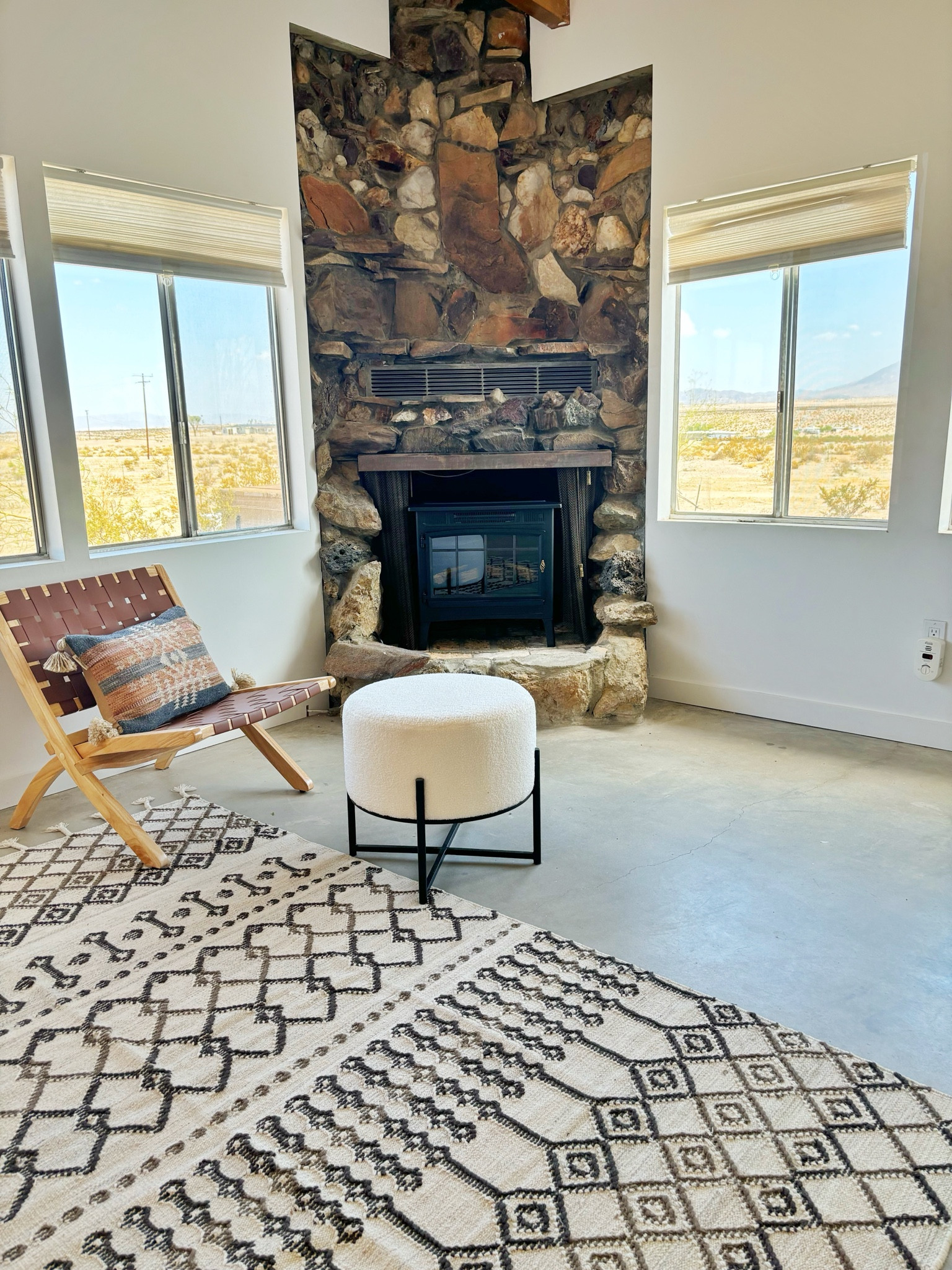If you look closely we added an electric stove to this fireplace.  It adds ambiance and heat with a button on a remote.  We don’t have gas at this house and we wanted to keep the campfire smell and mess in the outdoor fire pit.  This is a great solution for a vacation rental property where you want to keep things easy for your guests.  

#LTKStyleTip #LTKHome #LTKTravel