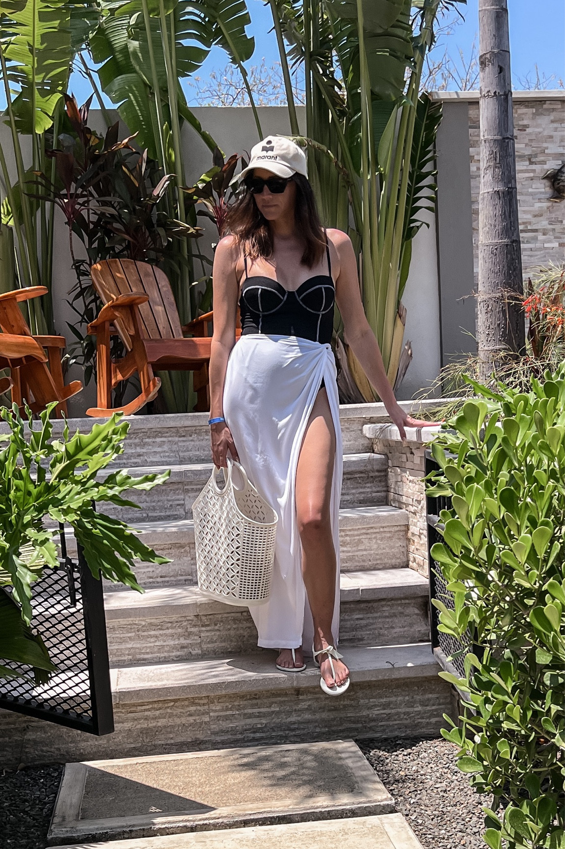 Black swimsuit, white cover up, beach look 

#LTKswim #LTKtravel #LTKFind