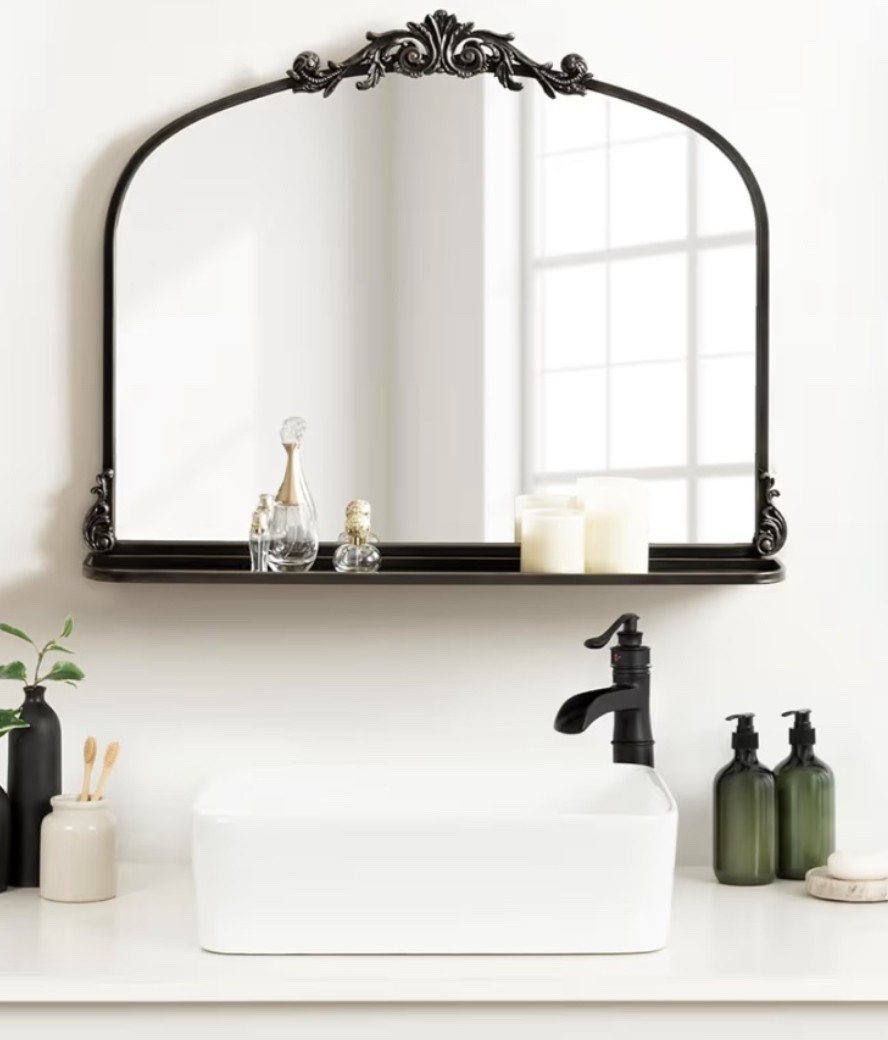 Vintage arched mirror with the prettiest antique-inspired detail and a functional little shelf for styling candles, perfume, florals, or everyday essentials. ✨ Perfect for a bathroom, vanity, nursery, hallway, or charming entryway moment. This gives instant old-world character without a full room makeover. 

Add it now while it’s available! 🌿

#LTKSeasonal #LTKHome #LTKU