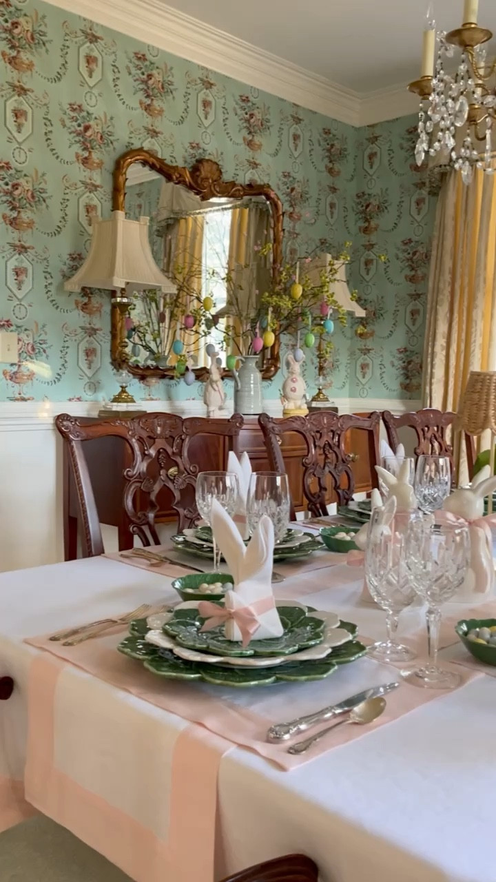 Happy Good Friday, everyone! ✝️✨🌷 I decided to give my Easter table a little makeover. Can you spot the changes? This year, it's all about soft blush pinks and pristine whites, with my linens creating a delicate backdrop for the vibrant green and white Geranium tableware. Silver flatware adds a touch of timeless elegance, while crystal glassware brings an extra sparkle to the setting. The gold leaf and rattan table lamps with charming scalloped hyacinth lampshades add a playful twist. And for a personal touch, each guest's place is marked by a bunny-folded napkin adorned with a pink bow. Adorning the table are the sweetest white bunnies wearing pink ribbon neckties, perfectly complementing my whimsical blooming cabbage centerpiece. 🥬🌷🐰 Are you hosting Easter festivities this year? I'm egg-cited to see how you're celebrating this beautiful season! Drop your plans in the comments and let's inspire each other to make this Easter one to remember.✝️🐰🥬🌷💕
.
.
.
#eastertable #housebeautifulhome #traditionalhomemagazine #solinohome #dressingthetable #victoriamag #tablescapestyle #classichomedecor #mytradhome #springtable #springtablescape #southernladymag #thecottagejournalmagazine #mycollectedhome #entertainathome #playwithyourdishes #myupcountrystyle #postitandsmile #thecollectedlook #bordallopinheiro #betterhomeandgardens #easterinspiration #festivedecor #diningroominspiration #entertainingideas #preppygrandhome #traditionalinterior #entertainandcelebrate

#LTKSeasonal #LTKhome #LTKparties