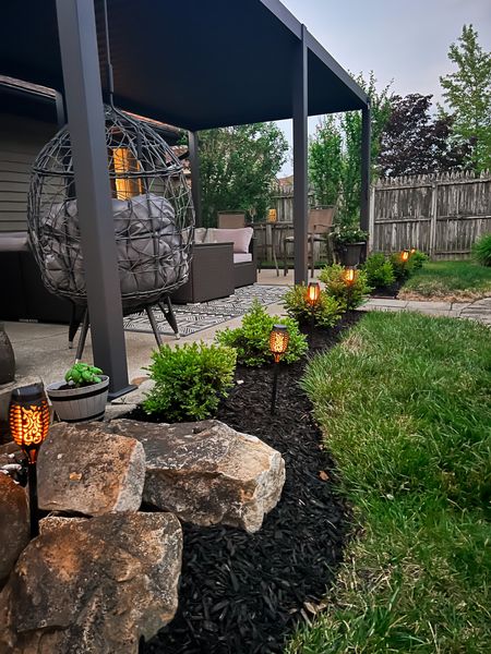 Pergola and patio views! Aluminum louvrered pergola from Wayfair - torch pathway solar lights - outdoor egg chair - outdoor rug - outdoor patio set - Amazon Home - outdoor decor - patio decor - Amazon finds 

#LTKsalealert #LTKSeasonal #LTKhome