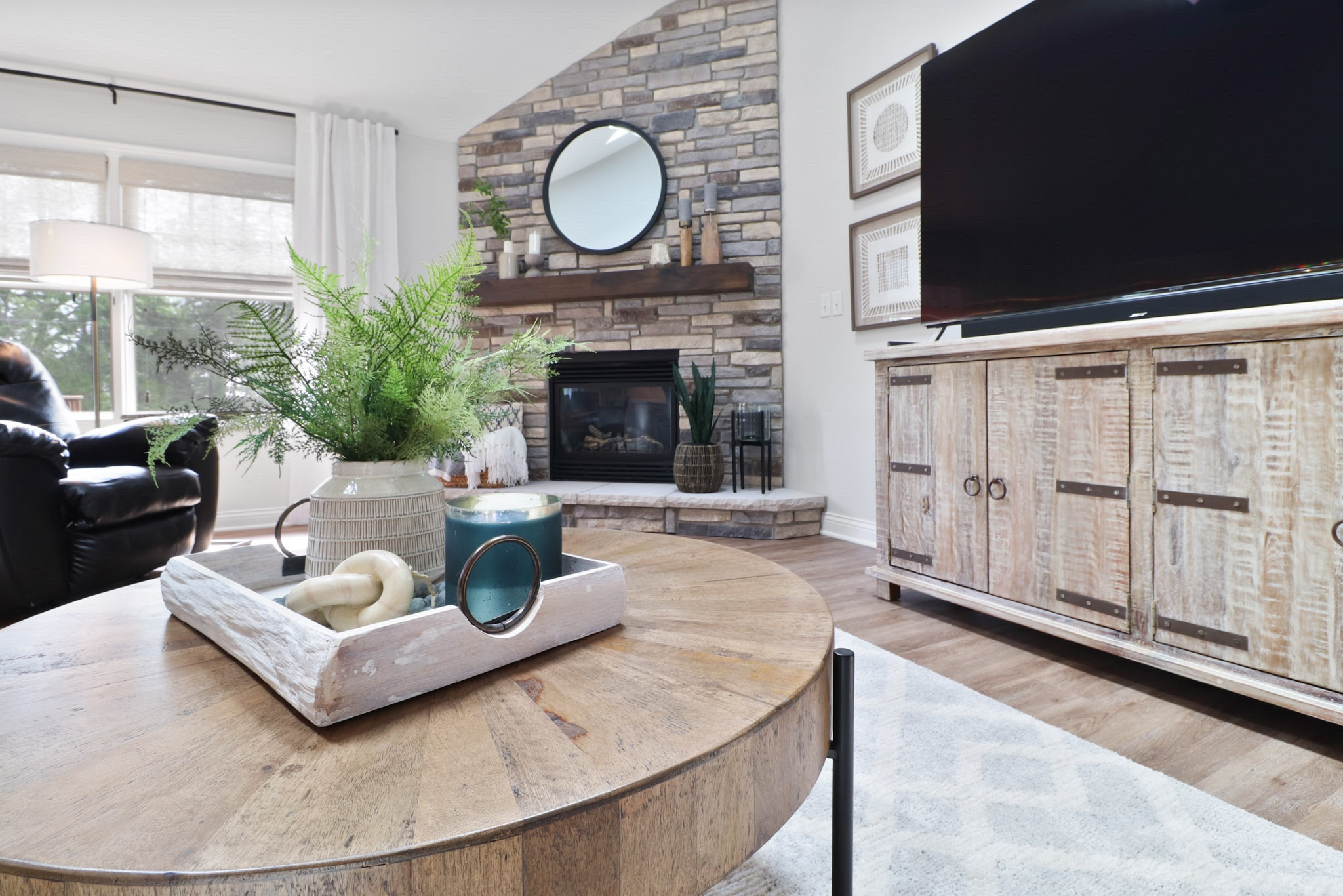 living room, fireplace, brick, tv stand, round coffee table, tray, plant, candle, decorative links, wall art, curtains, table decor

#LTKhome #LTKstyletip