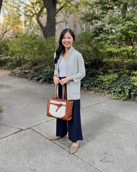 Fall work outfit, business casual outfit: J.Crew sweater blazer (XXS), white seamless tank top, similar navy wide leg pants, brown and canvas tote bag, similar leopard mules.

#LTKworkwear #LTKstyletip #LTKSeasonal