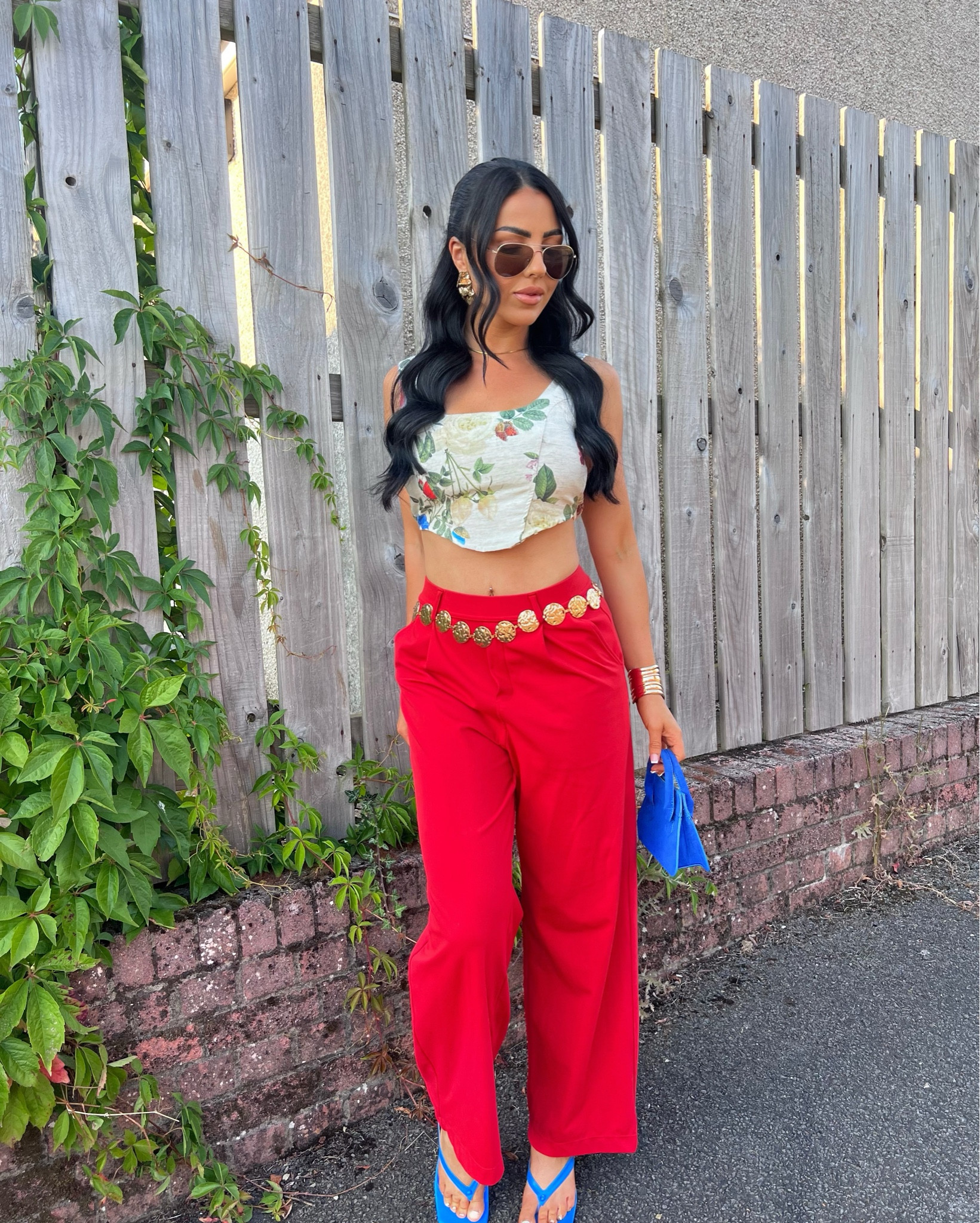 Summer vibes in full swing 🍓☀️
Loving a pop of red this season and these wide-leg trousers are everything — super comfy and perfect for day-to-night styling! I paired them with a cute floral cropped top, gold coin belt for a little glam, and finished the look with bold blue accessories (how fun are these heels?!).
This is your sign to play with color this summer 🔥💙


#LTKsummer #LTKpetite #LTKuk