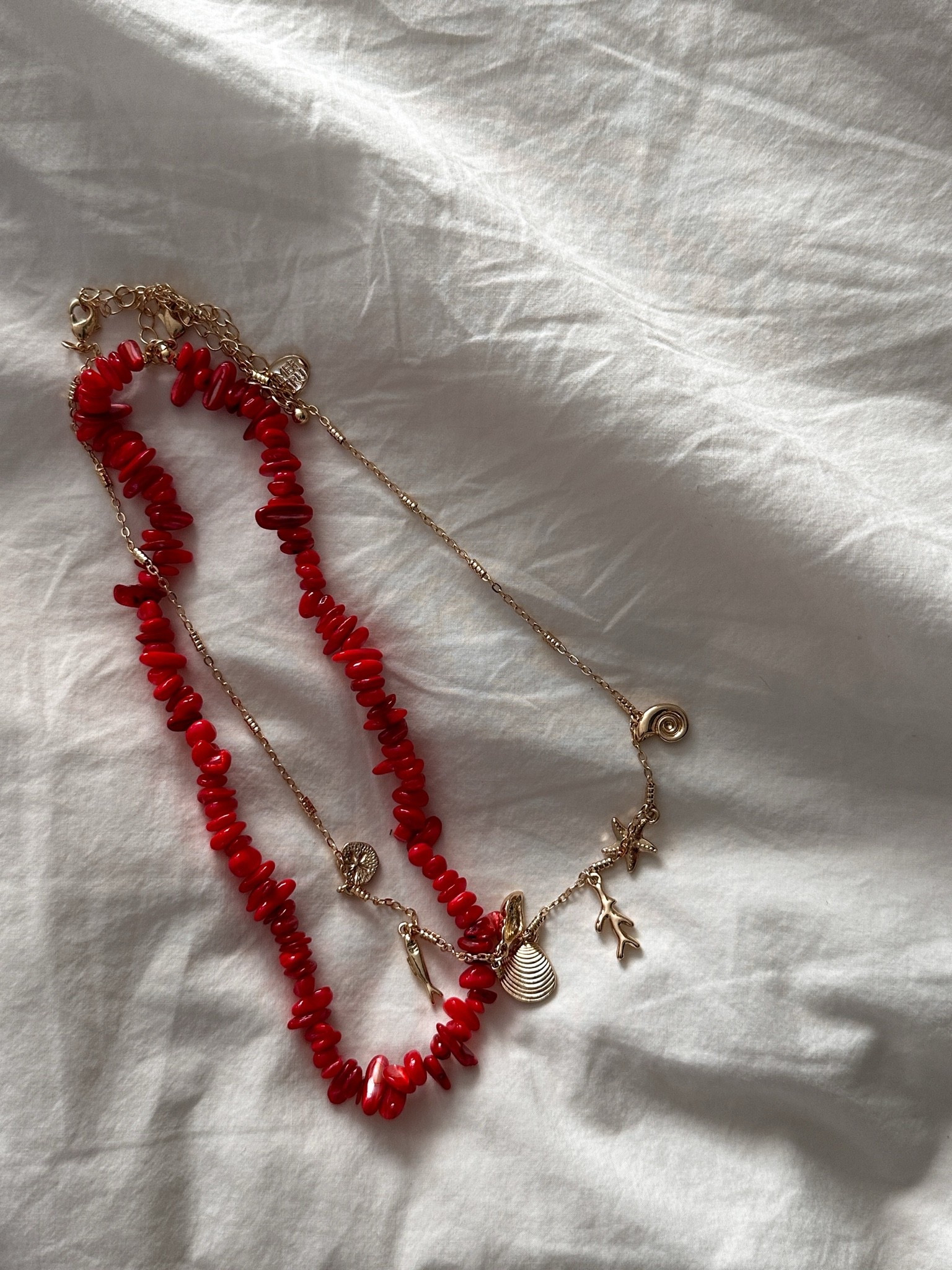 This Walmart necklace is so good and SO inexpensive!! Only $10! Come as a set but are 2 separate neckacles which I love.

Two color options and both are currently sold out but linking for reference.

Summer accessories, summer necklace, fish necklace, seashell necklace, red accessories, beaded necklace

#LTKootd