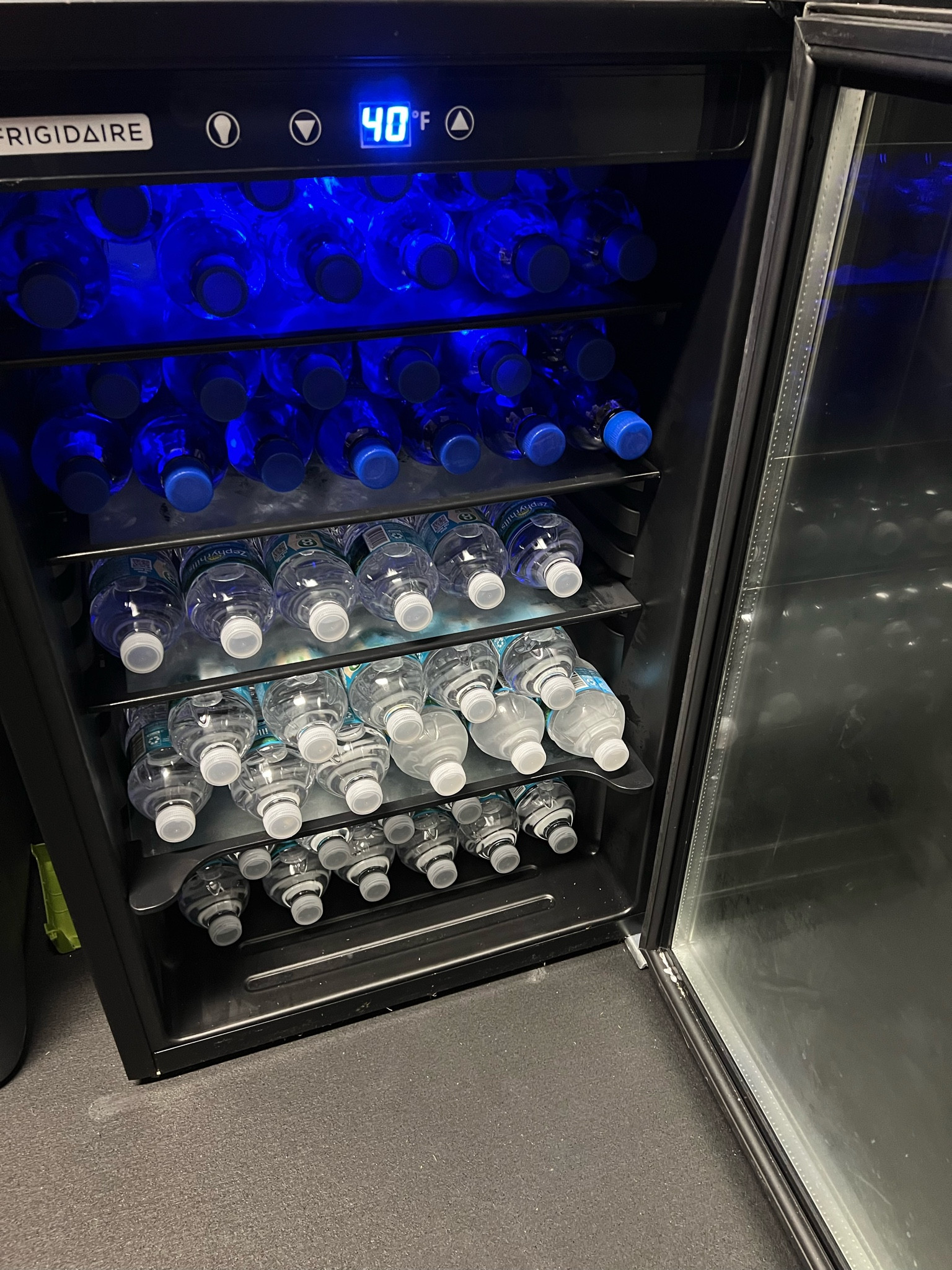 Stocked up our garage gym mini fridge with our favorite spring waters. We love this Frigidaire mini fridge! 