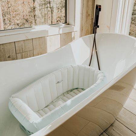 BABY BATH 🛁 let me tell you, i have tried so many bath tubs for baby girl and this one from amazon has hands down been the best! the reasons below are why this is the best one-

1. you save money on your water bill because you don’t have to fill up your entire bath tub for this, you just need to fill the inflatable with water to your desired level

2. it’s inflatable so if baby girl falls over she’s protected and also easy to store & travel with

3. it has a flexible cup holder (i use this for her soap), a hanging feature for easy drying, AND it has a ball attached to the bottom of it this way your baby can sit up without slipping or sliding down as you bathe them 

4. you can use this in the pool with them or even as a little mini pool so they can enjoy the nice sunny days out with the fam ⛅️ 

#LTKFind #LTKunder50 #LTKbaby