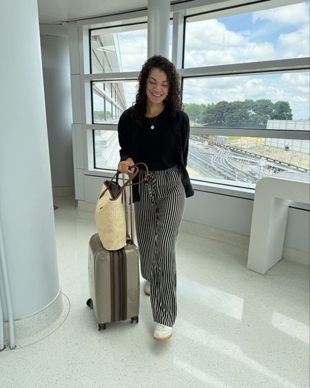 Casual cute travel look ✈️ Striped elastic waist drawstring pants strike the perfect balance between comfort and style. Mine are old from Dissh, but I linked some similar striped pants. A basic tee from Madewell (size small) is a nice layering piece for my linen button-down from Everlane (small). My straw tote bag from Madewell holds my essentials now, and works as a stylish travel bag in Italy! Linking my favorite travel bra too - it’s so comfy, you forget you’re wearing it 😉 

#LTKFindsUnder100 #LTKTravel