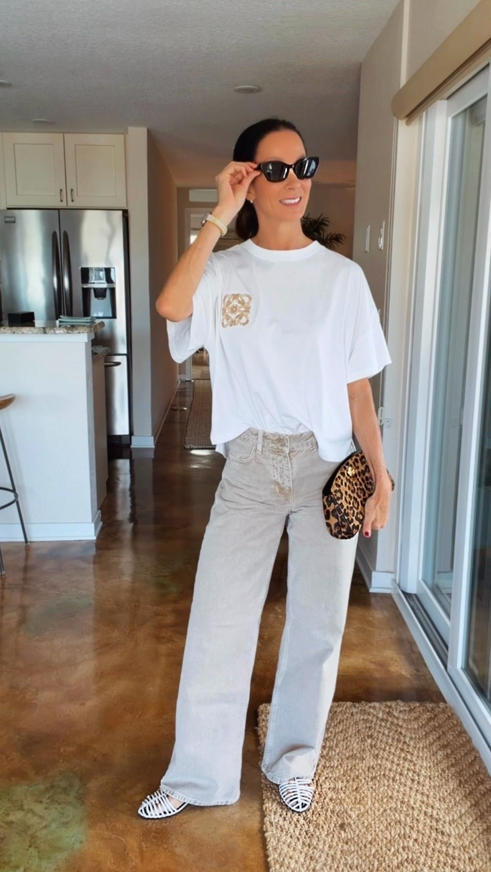 Mahjong with the girls, but you know I’m dressing for the occasion. 😉 Obsessed with the washed sandy color of these wide-leg jeans! Styled with a white Loewe logo tee, Celine cage sandals, Dior sunglasses and a leopard clutch for a little attitude. An easy jeans-and-tee outfit with accessories that do the most. 🤎

#LTKdayinmylife #LTKgrwm #LTKootd