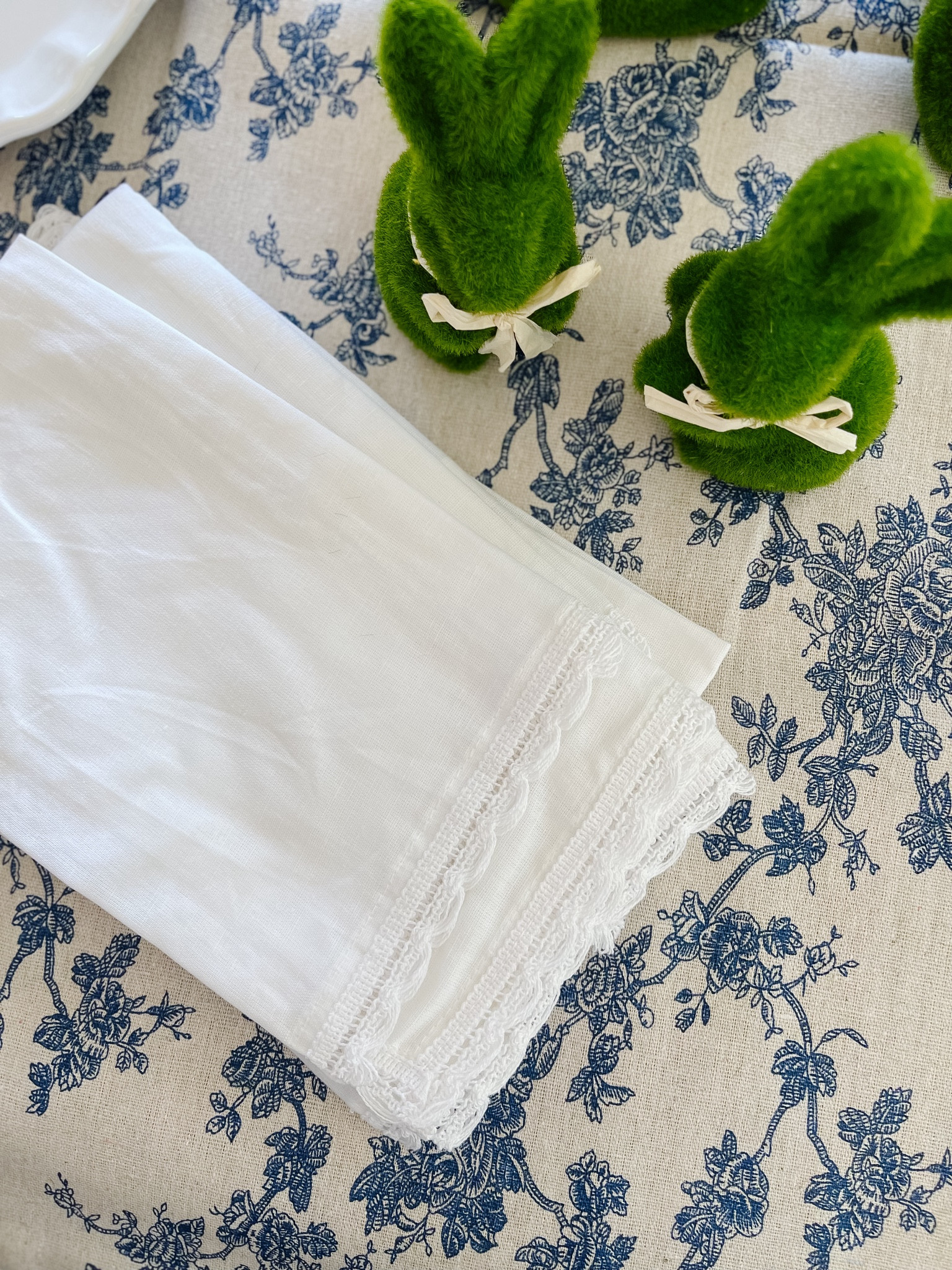 Amazon Easter prep - moss bunnies, white napkins with lace trim, vintage style blue floral tablecloth 

#LTKSeasonal #LTKparties #LTKhome