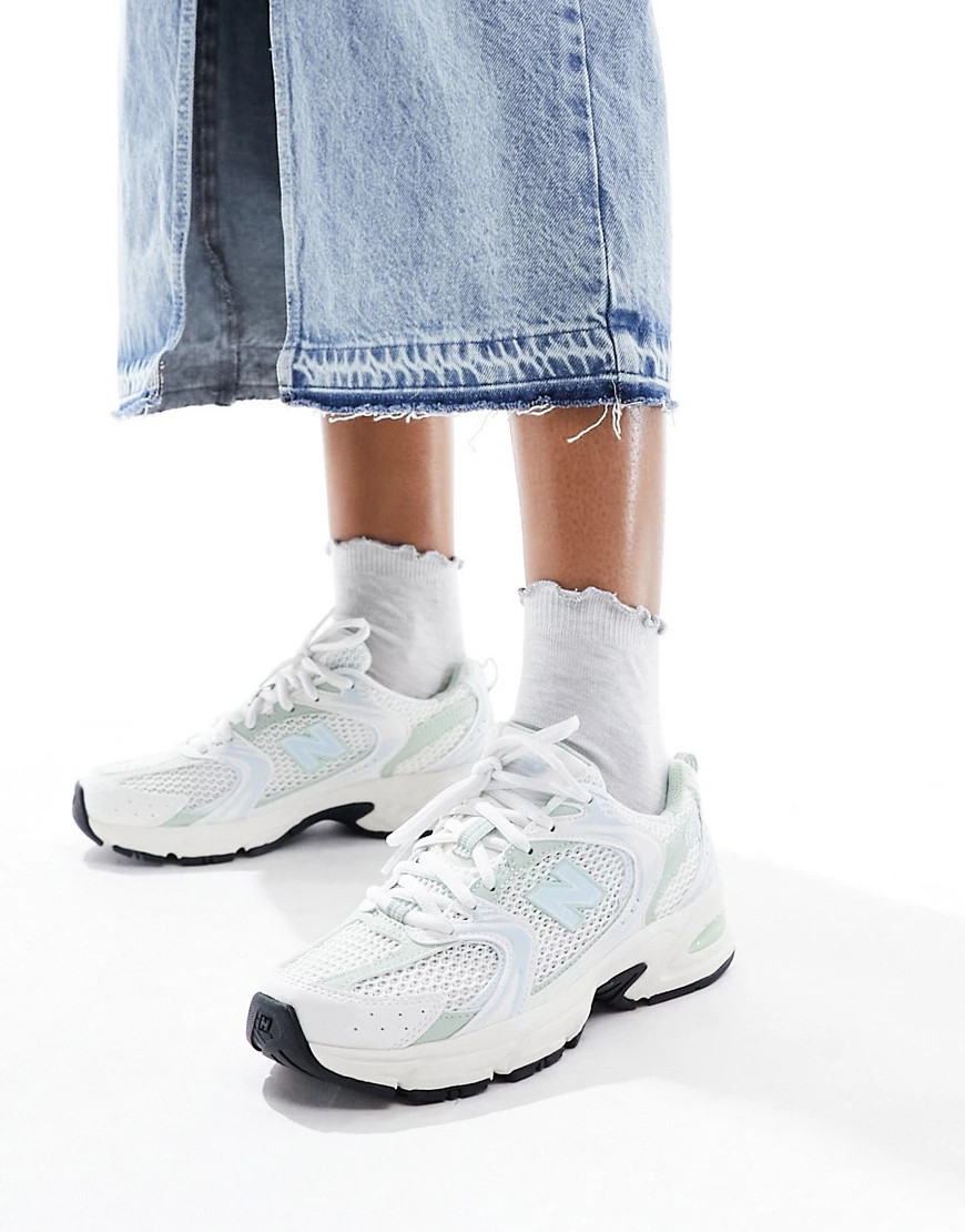 New Balance 530 sneakers in white with sage and light blue detail | ASOS (Global)