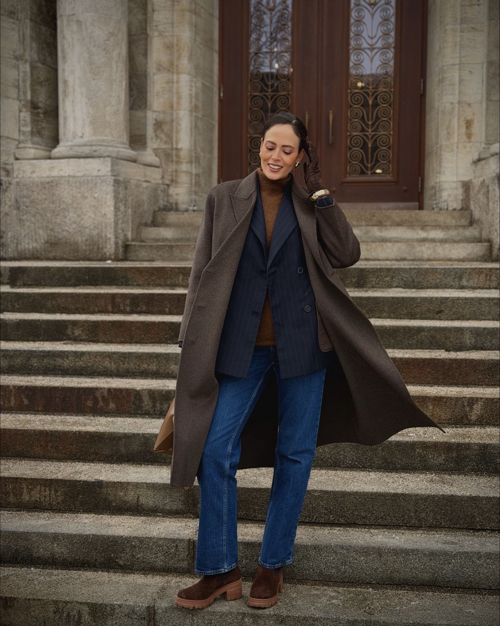 Πώς να κάνεις το layering να δείχνει «ακριβό» ☕️✨

Το μυστικό για ένα επιτυχημένο χειμερινό look δεν είναι απλά να φοράς πολλά ρούχα μαζί, αλλά να παίζεις με τις υφές και τις αναλογίες. 

Δες πώς δουλεύει αυτό το σύνολο:

1. Διπλό πανωφόρι: Φόρεσα ένα σακάκι με λεπτή ρίγα κάτω από το παλτό. Οι κάθετες ρίγες δίνουν δομή και «μακραίνουν» τη σιλουέτα, εμποδίζοντας τον όγκο των layering να σε καταπιεί.

2. Μονοχρωματική Παλέτα: Αντί για ένα total brown, επέλεξα διαφορετικές αποχρώσεις του καφέ και του ταμπά. 
Αυτή η διαβάθμιση δημιουργεί βάθος και κάνει το outfit να φαίνεται πιο ενδιαφέρον οπτικά.

3. Διαφορετικές υφές: Μαλλί, δέρμα και suede. Όταν μένεις σε ουδέτερα χρώματα, η ποικιλία στις υφές είναι αυτή που αναβαθμίζει το σύνολο.

4. Η ισορροπία του τζιν: Ένα κλασικό blue jean «ηρεμεί» το look και το κάνει ιδανικό για καθημερινές κομψές εμφανίσεις.

Style Tip: Μην φοβάσαι τα chunky μποτάκια με πιο επίσημα κομμάτια, δίνουν έναν σύγχρονο χαρακτήρα που εξισορροπεί την αυστηρότητα του σακακιού.

Για πείτε μου όμως, εσάς ποιο είναι το αγαπημένο σας στοιχείο σε αυτό το look? 👇

~~~~~~~~~~~~~~~~~~~~~~~~~~~~~~~~~~~~

Style Lesson: The Art of Tonal Layering ☕️✨

The secret to a sophisticated winter look isn’t more clothes, it’s more depth. 

Here’s the breakdown:

• The “Double Jacket” Rule: Layering a pinstripe blazer under a wool coat adds structure. The vertical lines elongate your silhouette, so the layers don’t feel bulky.

• Tonal Palette: Instead of one flat brown, I used a range of shades (tan, espresso, camel). This “tone-on-tone” approach creates a high-end, multidimensional feel.

• Texture Play: Mixing wool, suede, and smooth leather is the easiest way to make neutrals look interesting.

• The Anchor: Straight-leg denim and chunky boots ground the look, balancing the formal tailoring with an everyday edge.

Which layer is your favorite? The pinstripes or the oversized wool? 👇

#winterlayering #quietluxury #neutraloutfit #parisianstyle #effortlesschic

#LTKwinter #LTKeurope #LTKstyletip