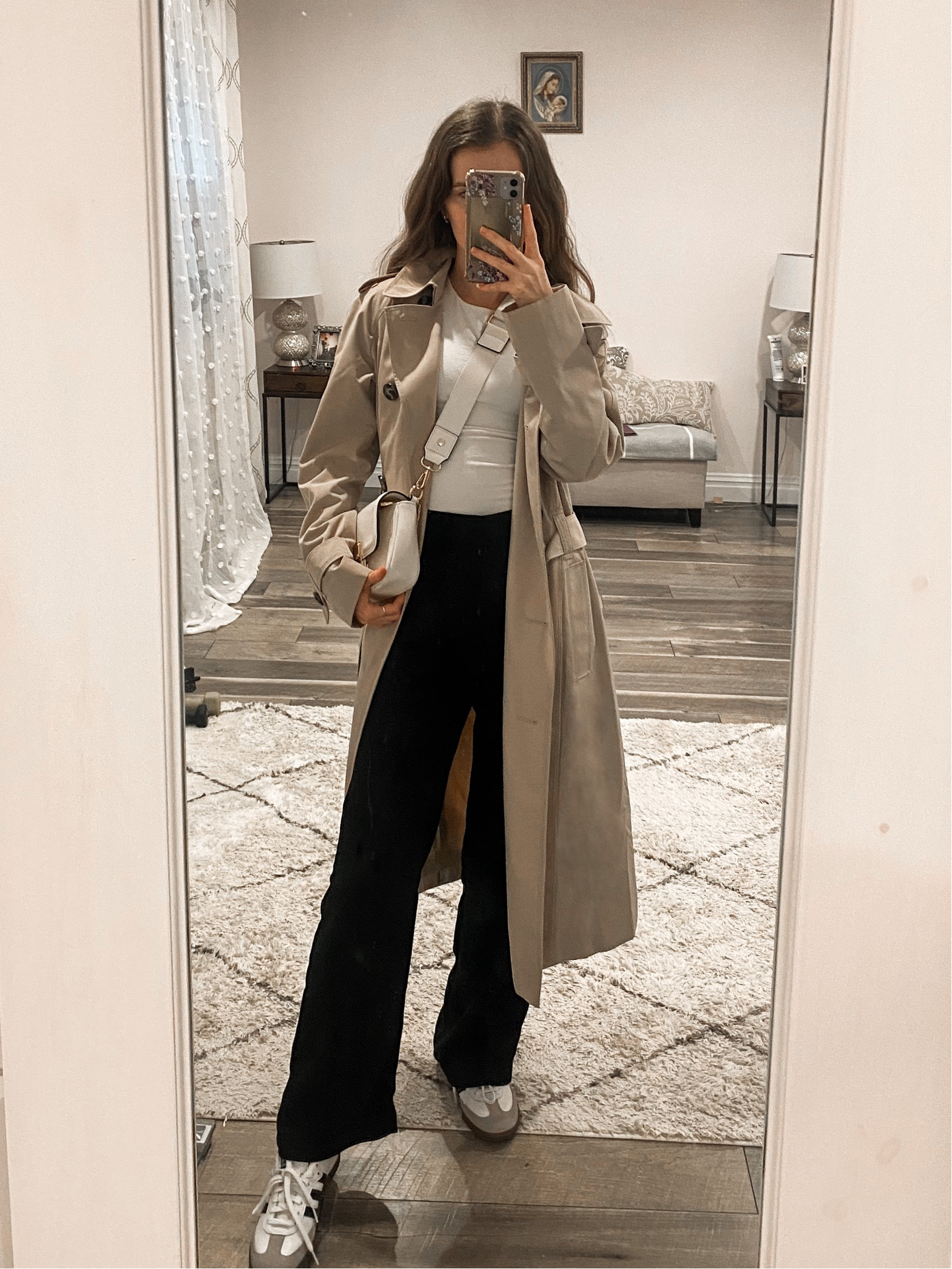 A trench coat paired with black pants, a bodysuit top, adidas sambas sneakers, and a crossbody bag makes a cute casual winter outfit. 
.
.
.
.
.
.
.
#LTKMostLoved #LTKGiftGuide #LTKSeasonal #LTKU #LTKsalealert #LTKfindsunder50 #LTKfindsunder100 #LTKstyletip #LTKworkwear #LTKtravel #LTKitbag #LTKFind #LTKunder50 #LTKunder100 
Winter outfits | casual outfits | casual work outfits | casual office outfits | trench coat outfits | long trench coat | tan trench coat | dress pants | black pants outfit | black dress pants | womens dress pants | black dress pants | black trouser pants | straight leg pants | basic tops | bodysuit outfits | white bodysuit | white sneakers | womens sneakers | designer bags | white bag | outfit ideas | outfit inspo 