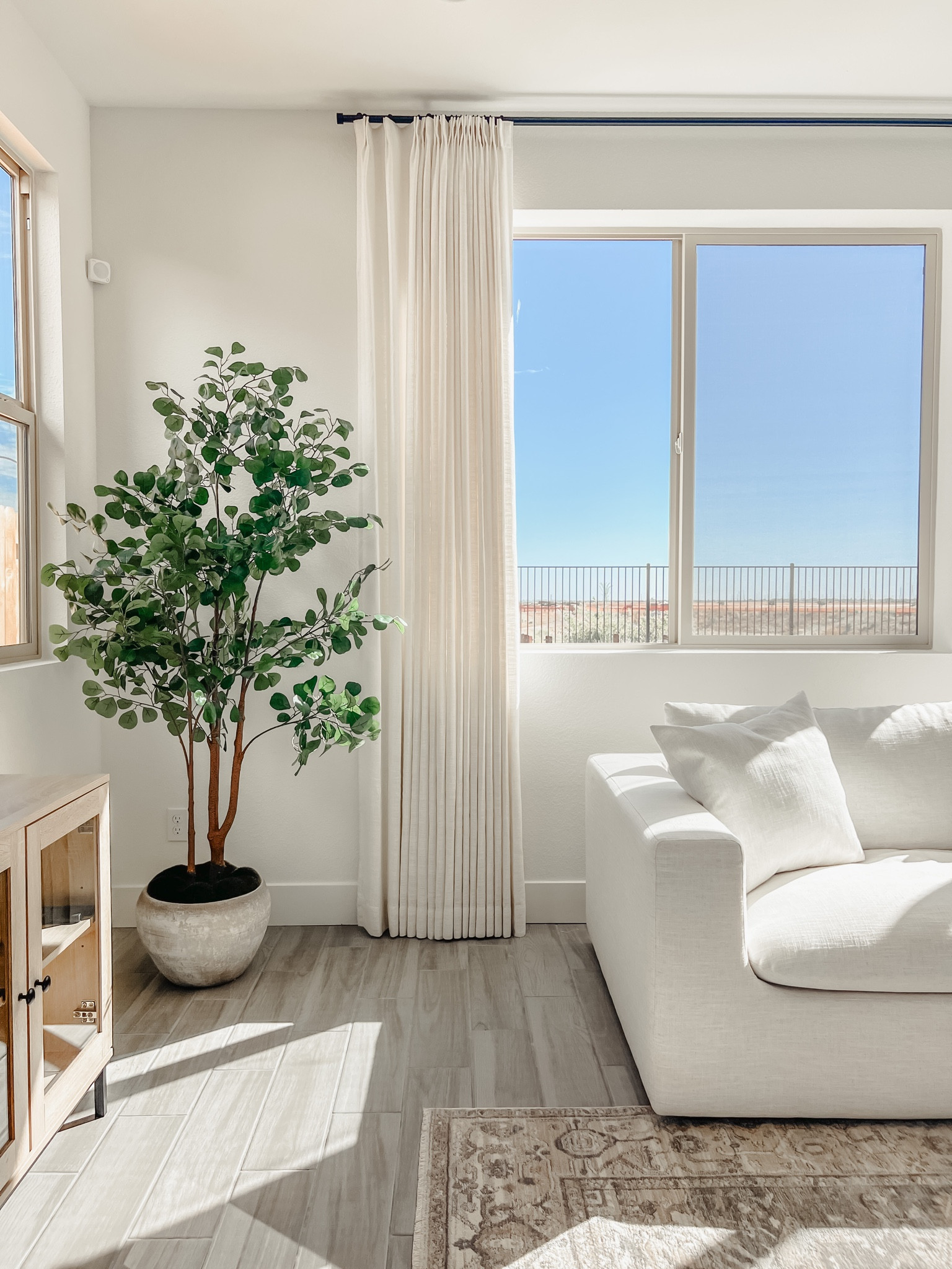 Our custom curtains from TwoPages dressed up our living room windows beautifully! We have the Liz Polyester Linen Drape Pleated curtains in Ivory White. Sofa is from Castlery. 

#LTKhome