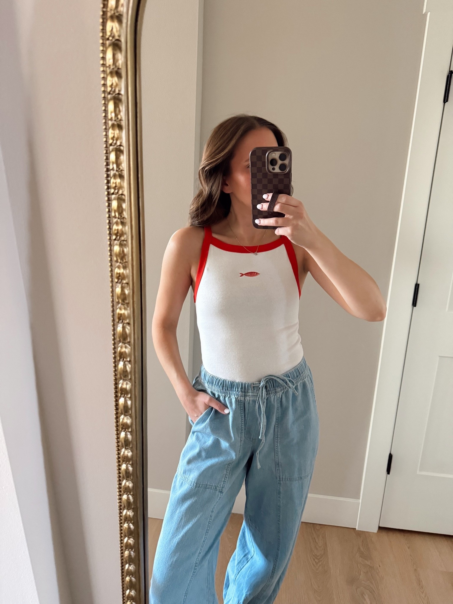 The cutest tank and it’s on sale and under $10! Wearing a xs 

Summer style, old navy finds, summer finds, fish tank, chambray balloon pants, on sale
