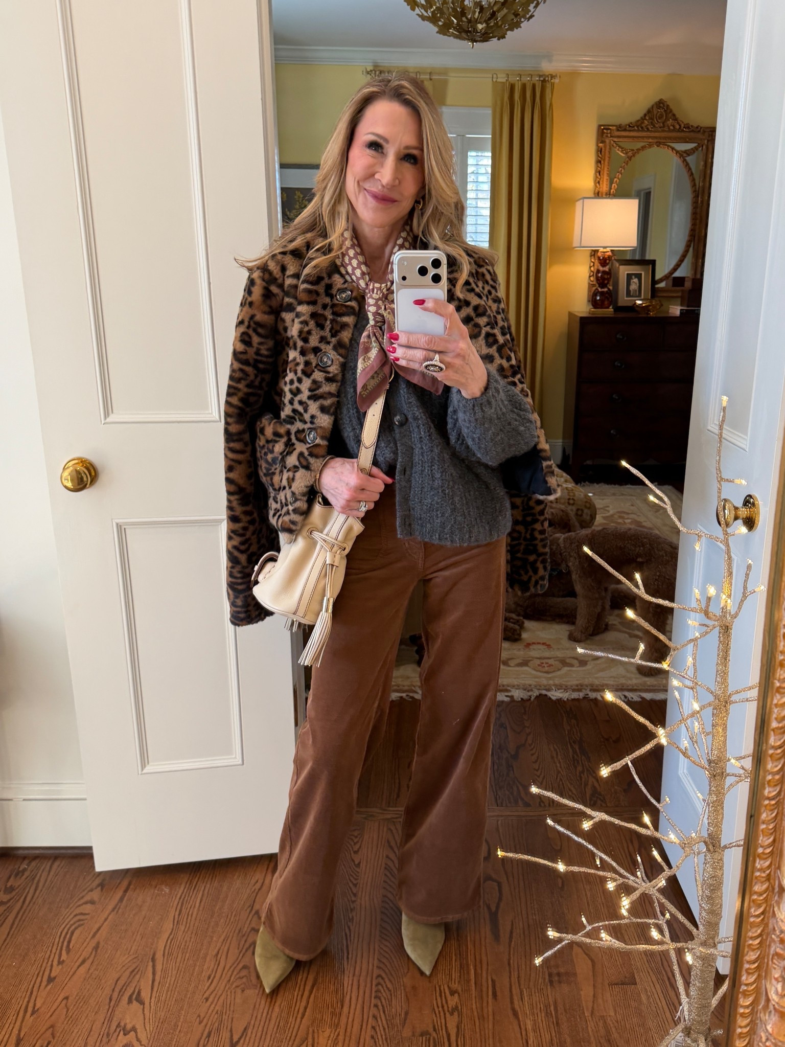 Winter layers don’t have to be boring!  I’m wearing brown corduroy pants, a grey cardigan sweater, matching printed bandana and pistachio green suede booties.  A cream bag and leopard coat complete the look!


#LTKSeasonal #LTKootd #LTKOver40