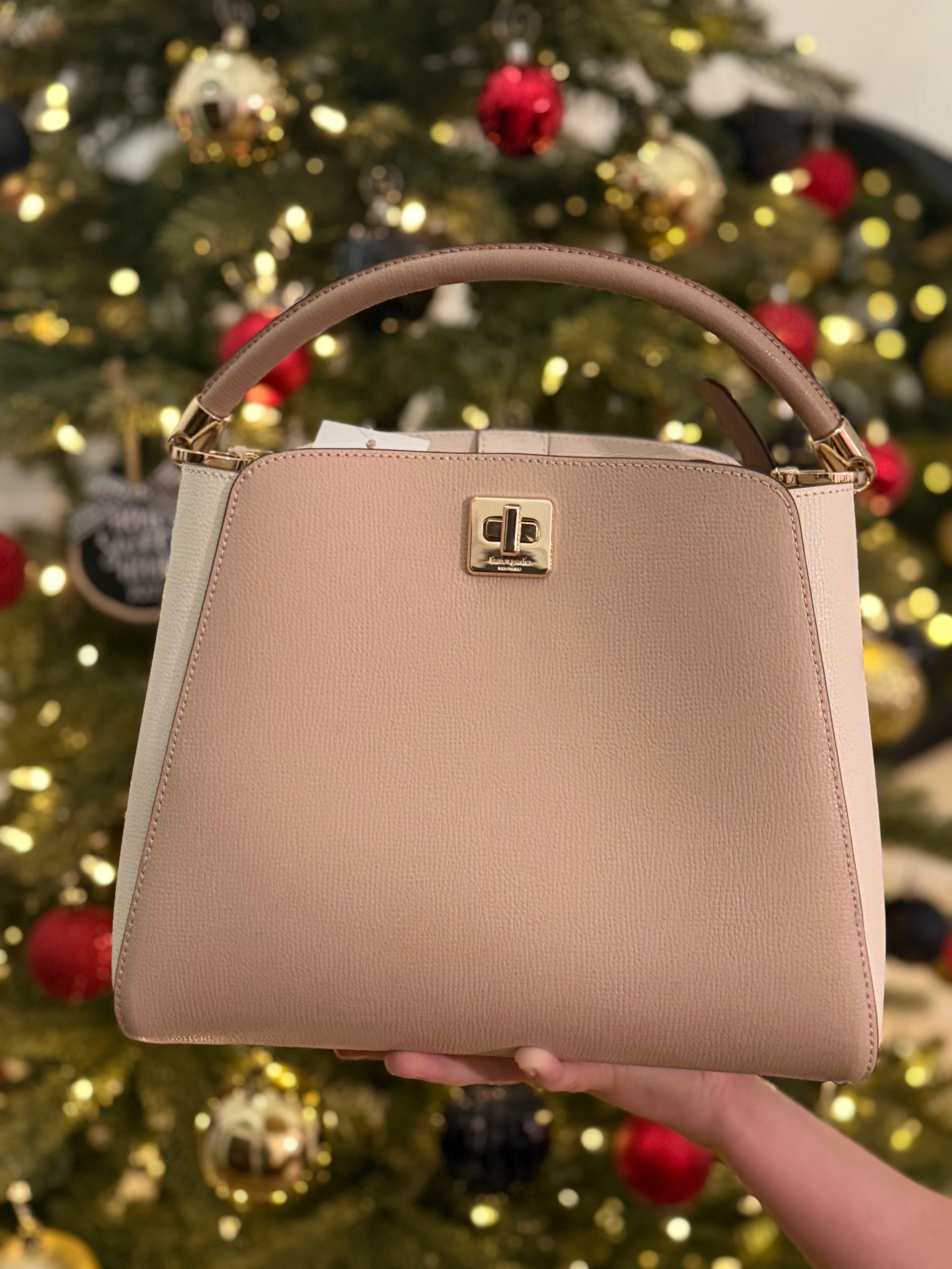 This Kate Spade bag is even more gorgeous in person. It’s so versatile; It can be used as an everyday purse or to add a fancy flair to your outfit for a night out on the town! #giftguide #giftsforher

#LTKGiftGuide #LTKSaleAlert #LTKHoliday
