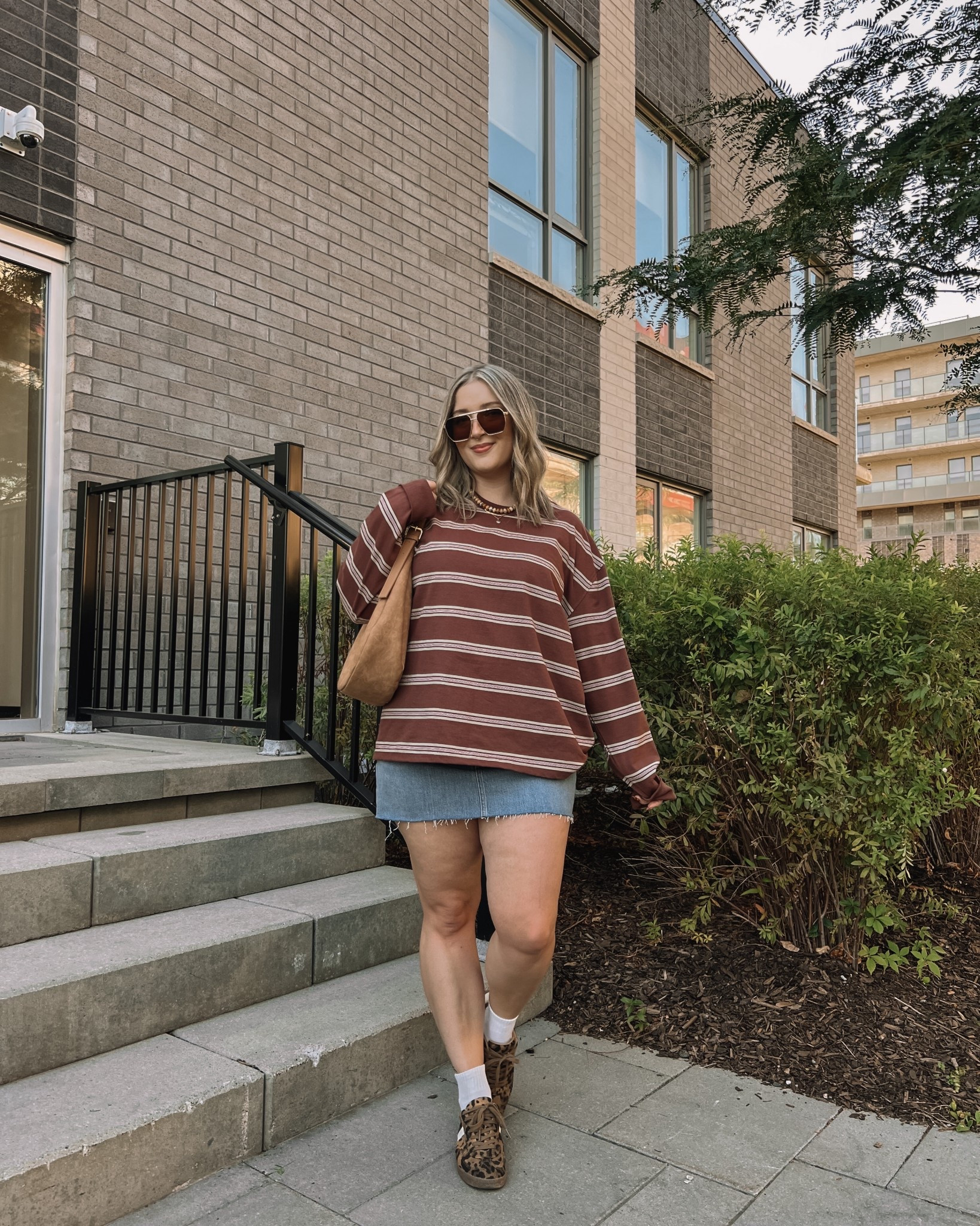 Easy fall outfit! My striped long sleeve is actually from the men’s section! Wearing an XL for a super oversized fit. Canadian shirt link in similar products. Wearing my usual size 32 in the denim skirt. Linked similar suede bags and leopard print sneakers
#LTKFall 

#LTKsale #LTKmidsize #LTKstyletip
