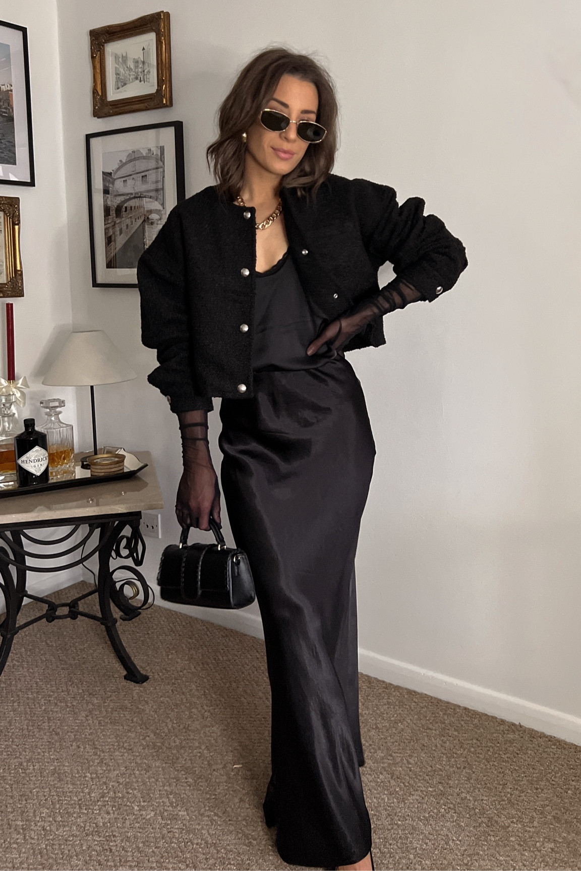 LFW outfit. Black satin maxi skirt. Black silk tank. Black boucle bomber jacket. Black kitten heel sling backs. Black mesh high elbow gloves. Chunky gold jewelry. Black handbag. Chloe inspired sunglasses. 

#LTKeurope