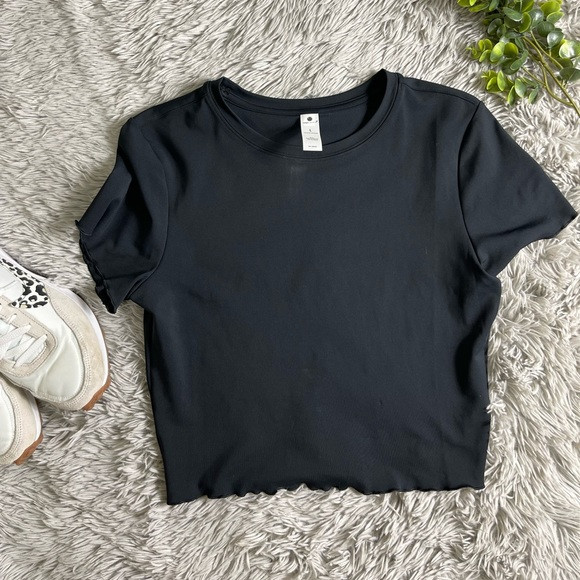 NWT YOGALICIOUS Airlux Valentine Baby Lettuce Baby Tee in black size L | Poshmark