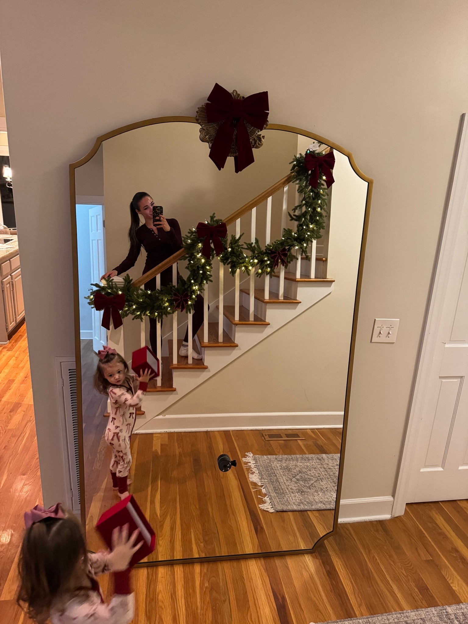 Large gold mirror with Christmas garland and bows! 

#LTKStyleTip #LTKSeasonal #LTKSaleAlert