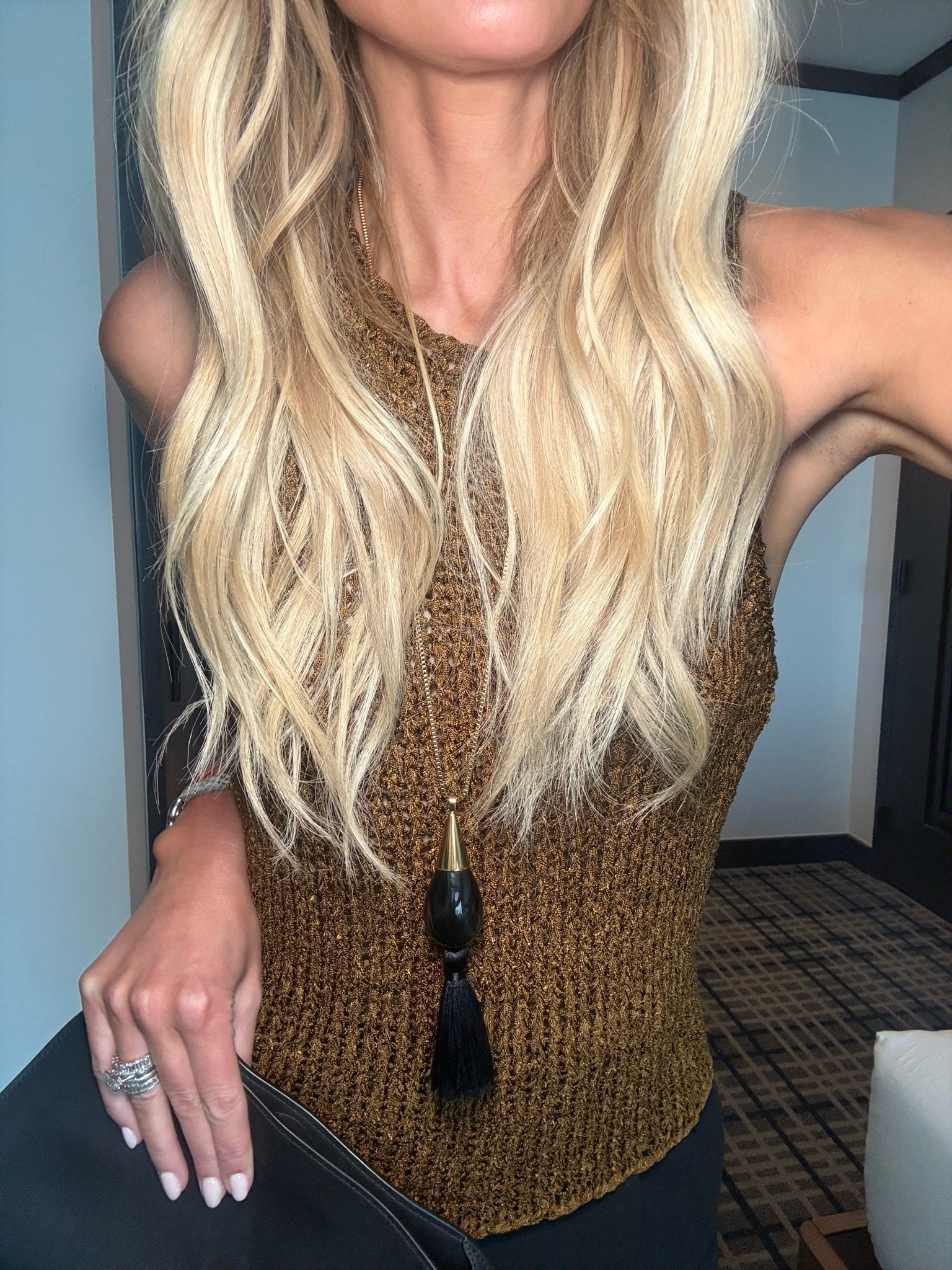 This sweater tank is stunning. I am in the size small. If between sizes, you can size up.