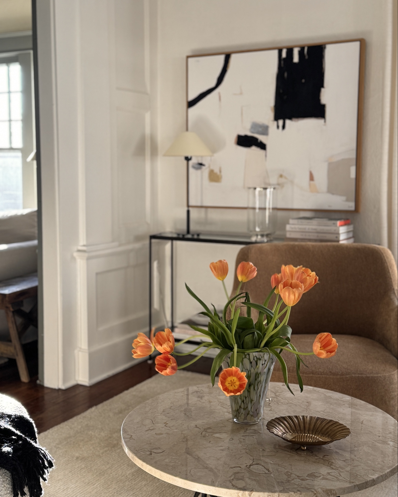 Golden hour with a pop of spring 🌷 here’s a little video so you can see how our front room is laid out. Tucking the curved sofa beside the staircase and using multiple chairs makes it easy to shift furniture around while providing lots of seating!

#LTKStyleTip #LTKHome #LTKFindsUnder100