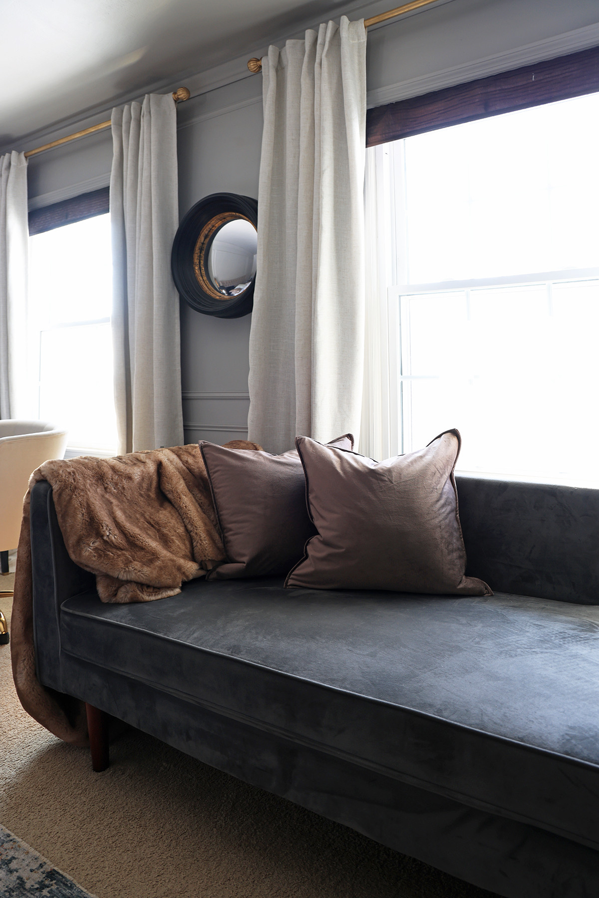 Mocha colored throw pillow covers | Fur throw blanket | Round mirror 

 #LTKHome