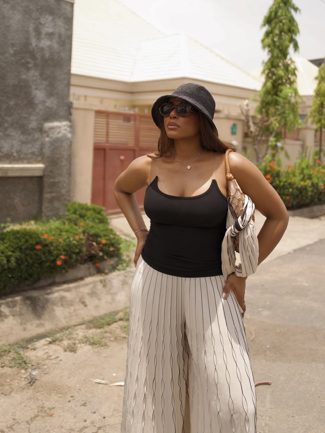 Warm weather outfit for Coachella, beach vacation, and more. Wearing houdini tank, linen pants from cos, lack of colour bucket hat, krewe sunglasses, staud handbag - 

For more links to spring outfits 2026, easter dress women, easter outfits women, date night outfits, vacation outfits beach, spring dresses, easter basket ideas, work outfits, country concert outfits, follow me on LTK! ✨

#LTKdayinmylife #LTKTravel #LTKFestival