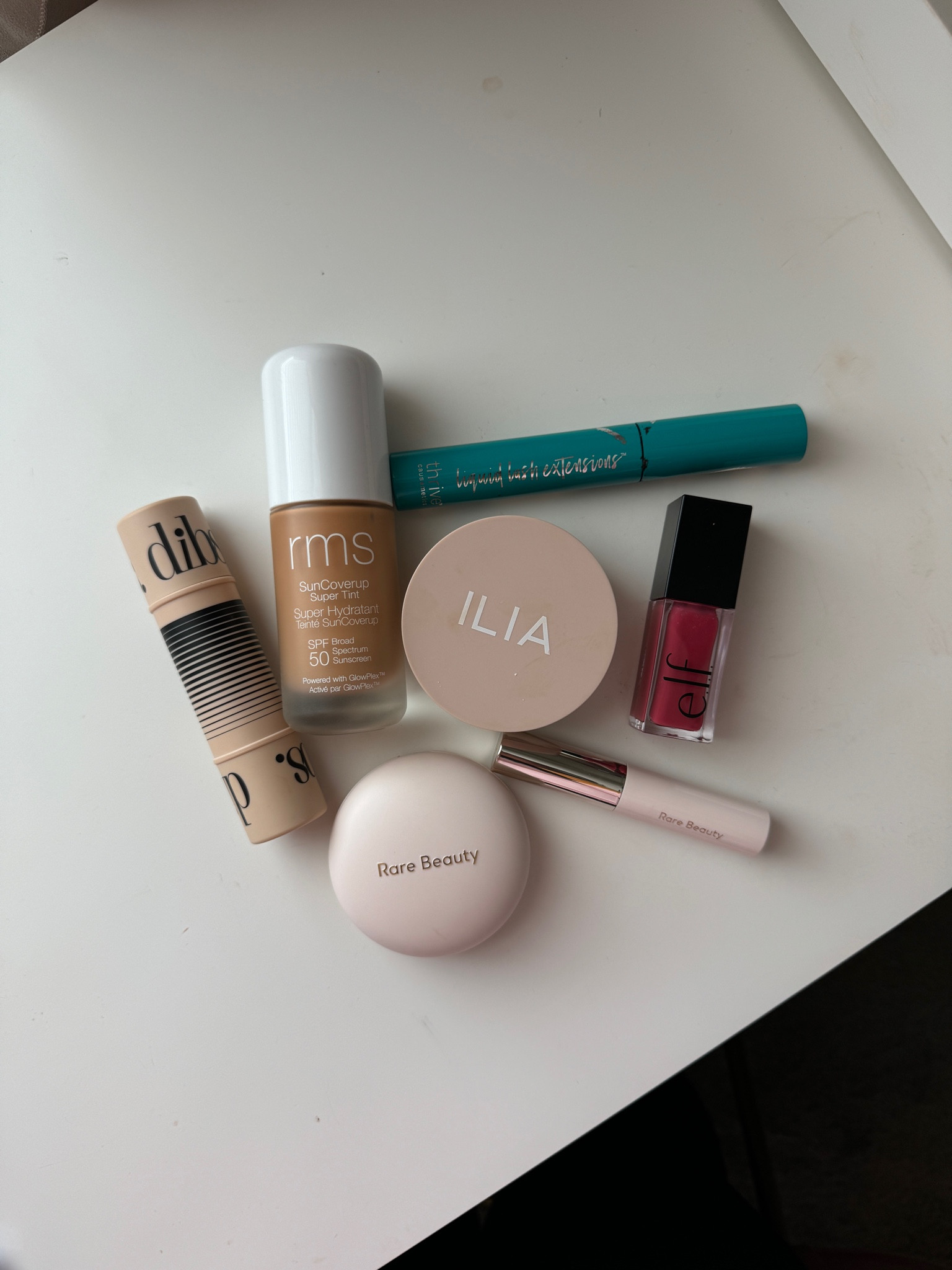 RMS skin tint, shade Honey / DIBS cream bronzer-blush, shade 5.5 / ILIA finishing powder / Rare Beauty brow gel / Elf Lip Oil shade Rose Envy / Rare Beauty Powder Blush, shade Joy / Thrive Causemetics mascara 

#LTKBeauty