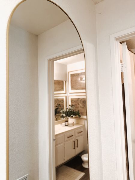 New full length gold arch wall mirror! Easy way to open up a small space. Roughly 30x72. Wall mount or standing frame option 

#LTKHome #LTKStyleTip