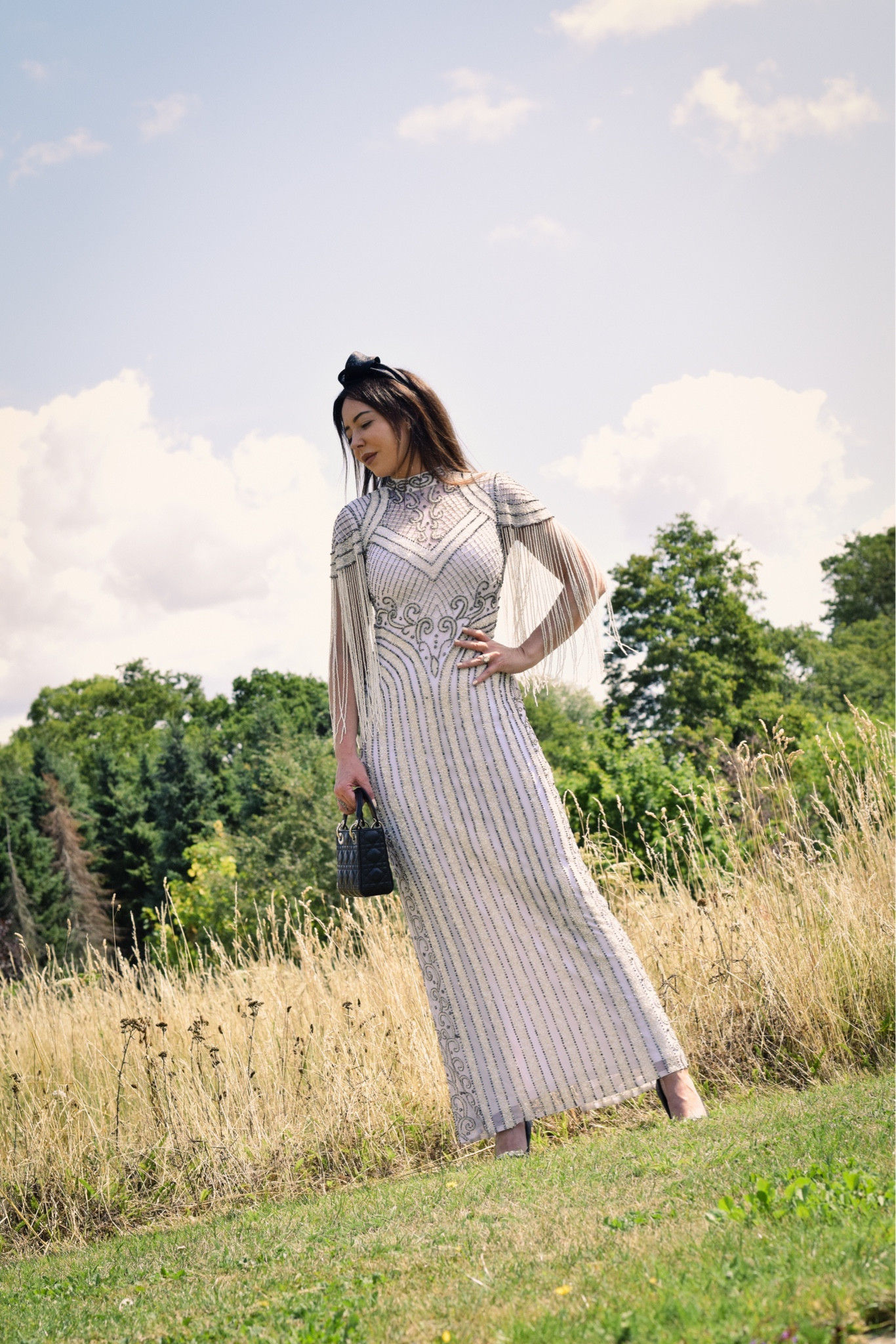 Fringe, beaded cap sleeve maxi dress, black headband, black quilted handbag, black heels 

#LTKeurope #LTKstyletip #LTKSeasonal
