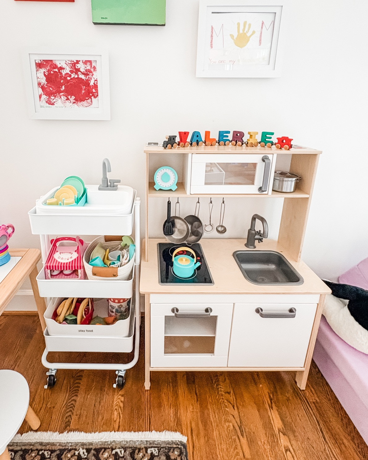Here's another example of a three-tiered cart used in a way that fits this family's lifestyle and needs. We use these carts for everything - snacks, art supplies, baby needs (think diapers, wipes, burp cloths), and so much more. This setup is perfect for holding all those little kitchen accessories so your mini chef can easily access whatever dish/food/tool they need!

Give us a shout if your kiddos need some structure to help keep their playroom in check! 

 