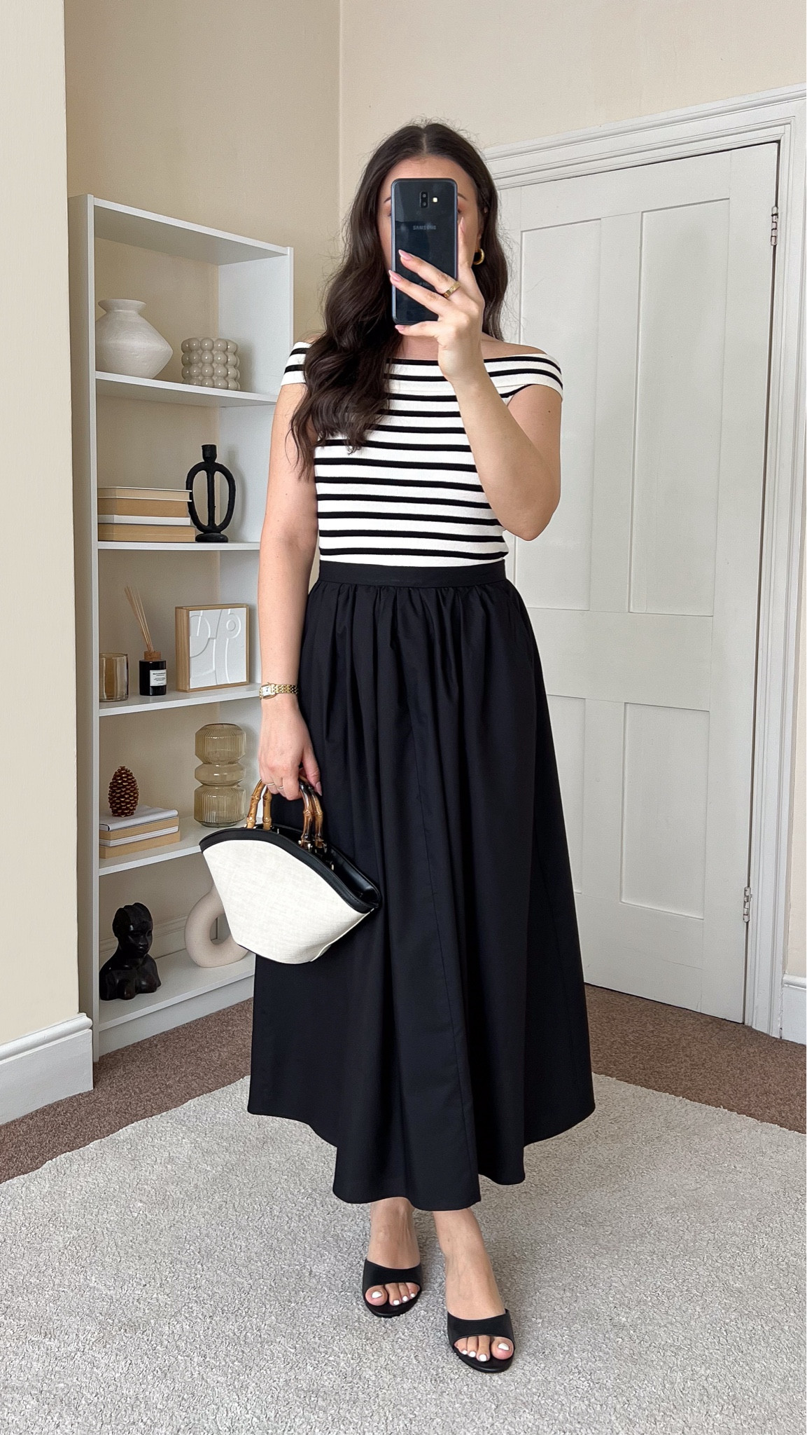 Casual chic summer outfit with a black poplin skirt. Skirt is Asos, wearing size M. Top is H&M, wearing size S. Mules are old from H&M. Bag is Motf.

#LTKuk #LTKeurope #LTKsummer