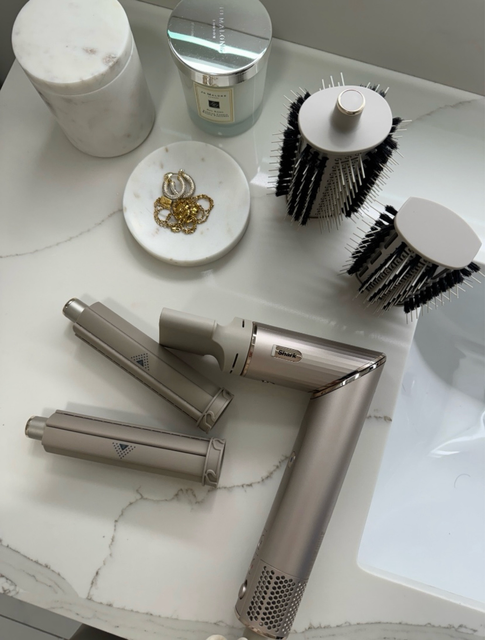 This Shark air wrap system is half the price of the Dyson and it works beautifully! It’s beginner-friendly and easy to use (even when you’re in a rush!) I love that it converts into a hair dryer with the styling nozzle because that’s what I use the most when blowing out my hair. Such a great piece to have whether you’re looking for an everyday blowout or a more styled look. 

#LTKBeauty