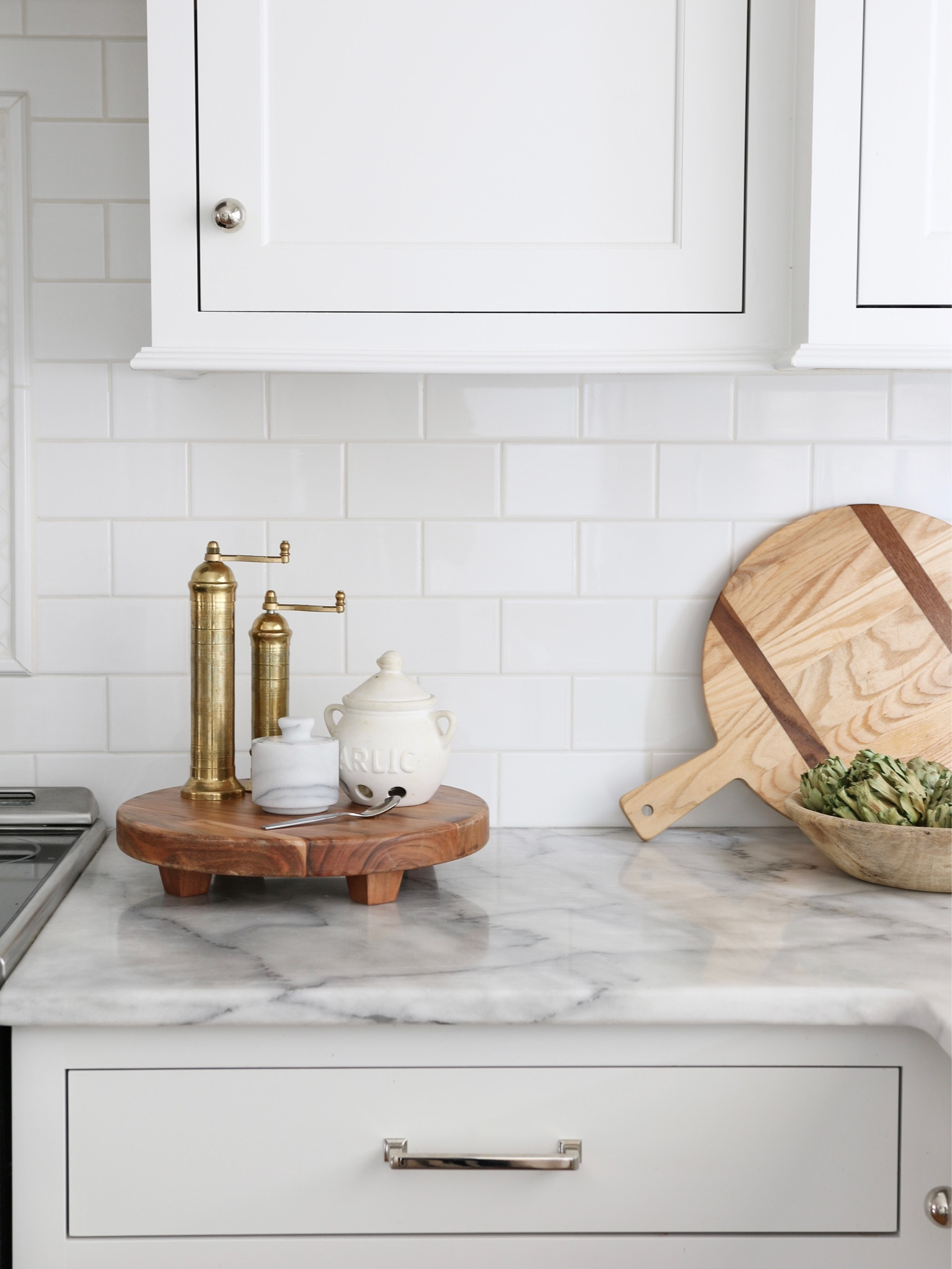 This is a great option to style the most used items like spice mills and cutting boards. The footed pedestal is from Target Hearth and Hand. The salt and pepper mills are from Meridian and the garlic keep and sale seller are from Amazon 

#LTKstyletip #LTKFind #LTKhome