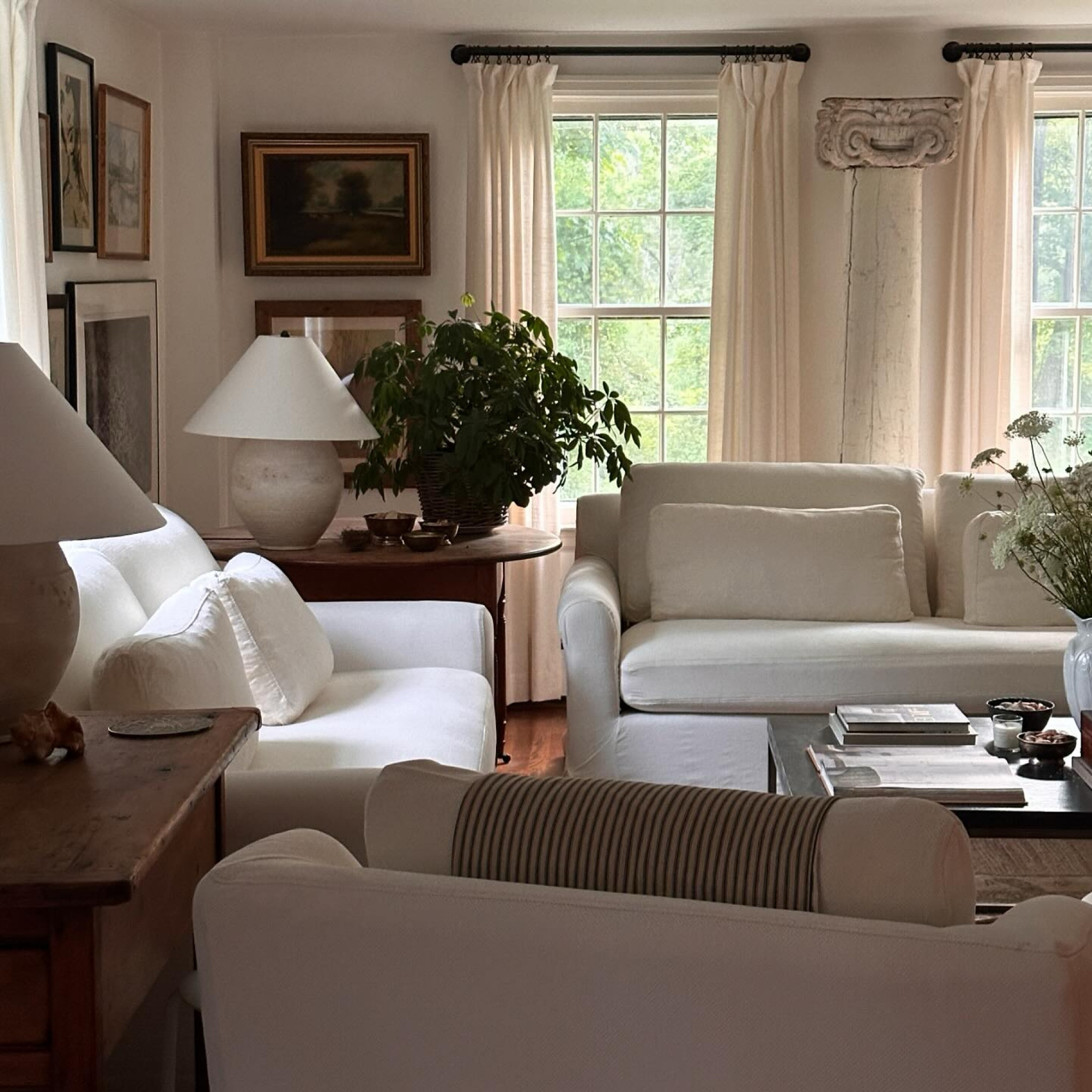 Freshly washed slipcovers and new lamps for the living room!! How perfect are these lamps?! I actually ordered them for the den but the moment I opened them up I knew they were meant for this room. I love them so much!! 🤍  you can find them on @shop_ltk linked in my profile.  #nancymeyersaesthetic  #collectedhome #livedininteriors #collectedinteriors  #toneontone #whiteslipcovers #mypotterybarn