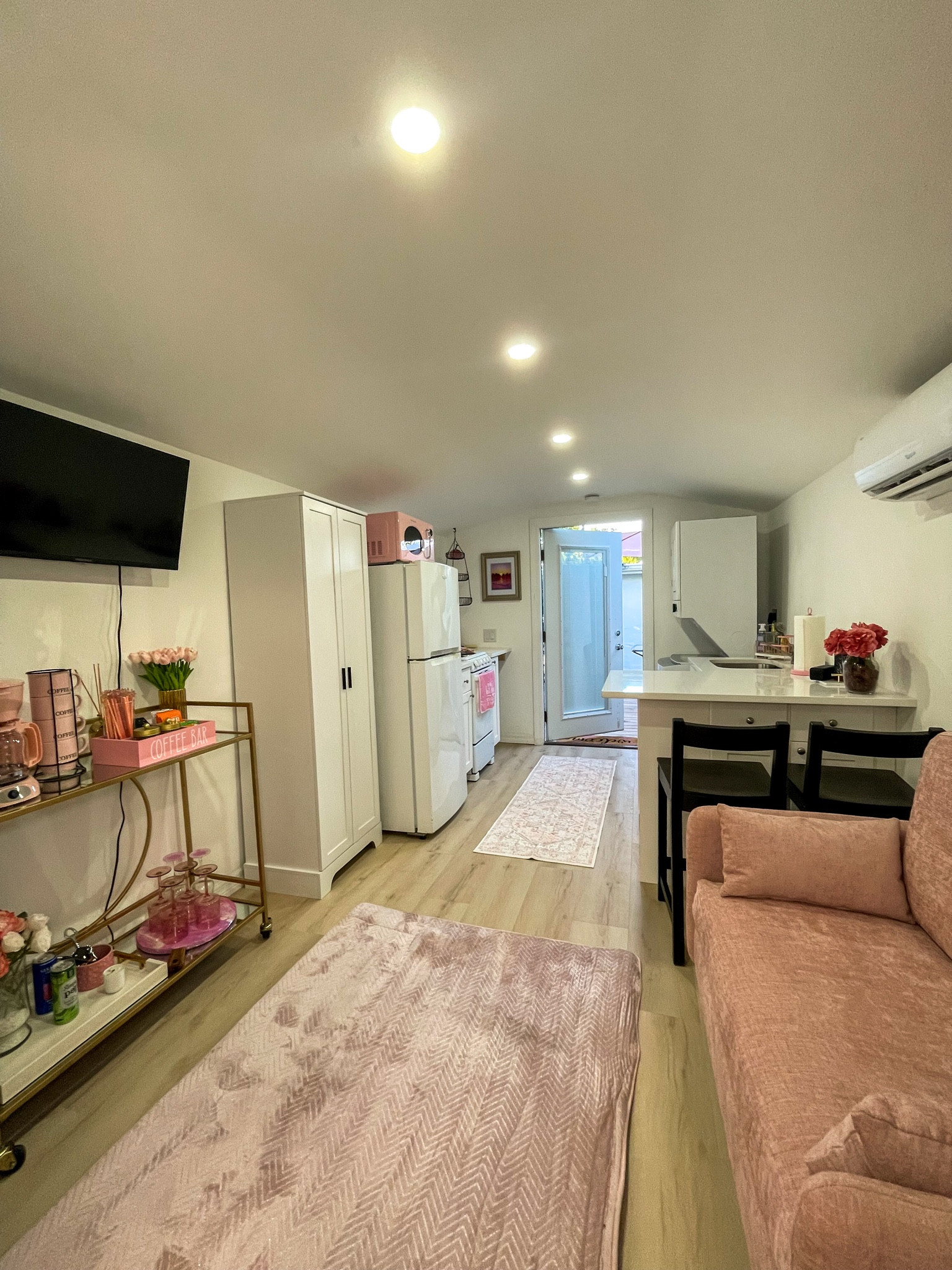 A long cozy view of The Pink Casita — warm, pink, and peaceful.