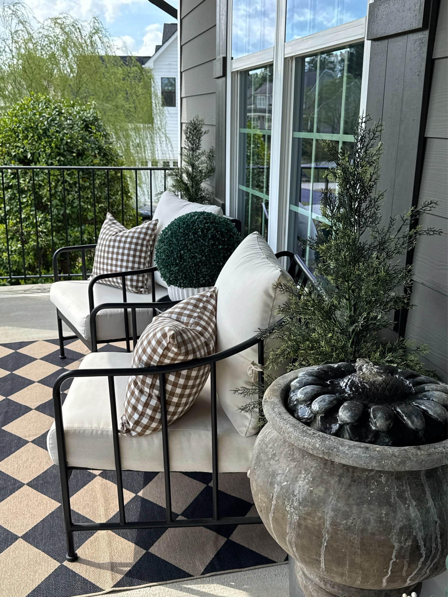 Spring Front Porch
I cannot link my fountain. It is made by Henri Studios💦

Diamond print outdoor rug, 3 piece conversation set, gingham print outdoor pillow covers, pillow inserts, faux cedar trees, faux boxwood balls

#LTKstorytime #LTKSeasonal #LTKHome