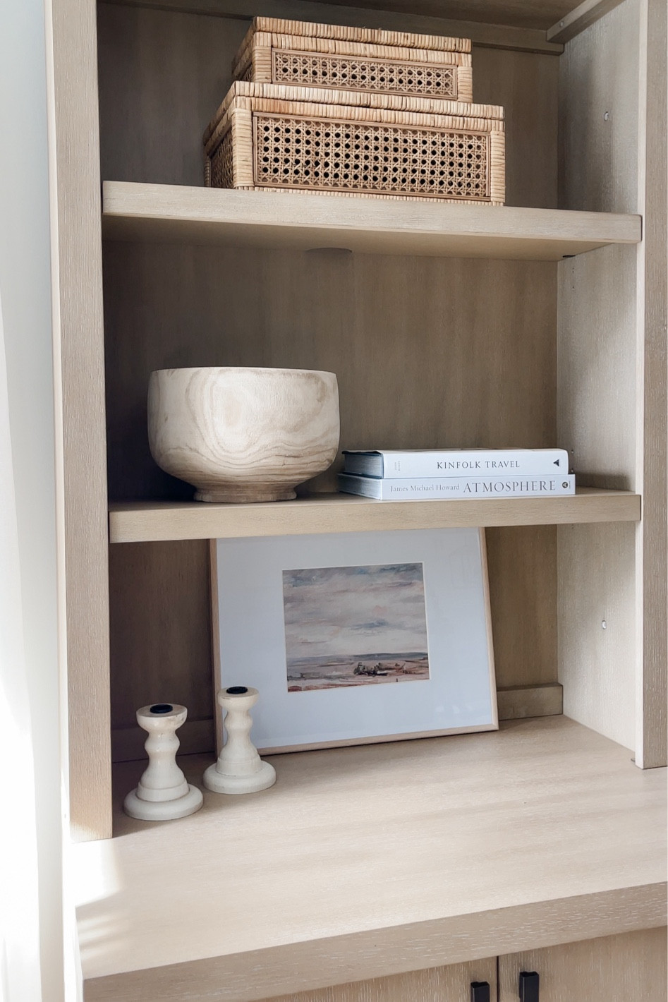 Shelf styling! 
Rattan boxes, wood bowl, books, frame, art, cabinet, shelves 

#LTKstyletip #LTKhome