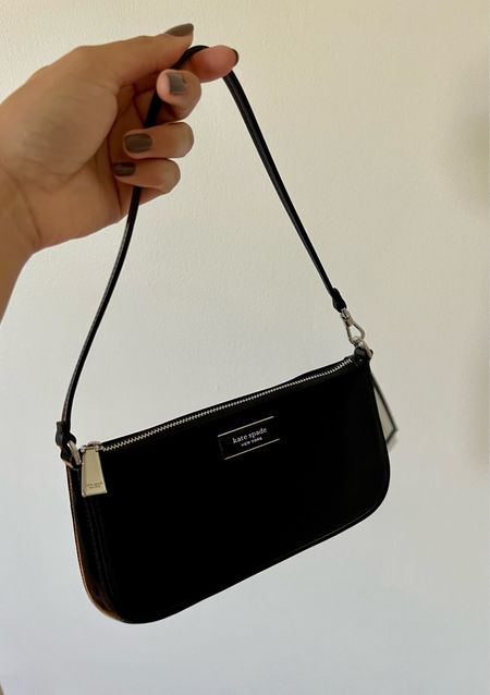 The Sam Icon KSNYL bag from kate spade new york takes inspirated from the original Sam bag, debuted in the '90s. This mini pochette style is crafted of sporty nylon and finished with leather trim.

#LTKitbag #LTKsalealert #LTKGiftGuide
