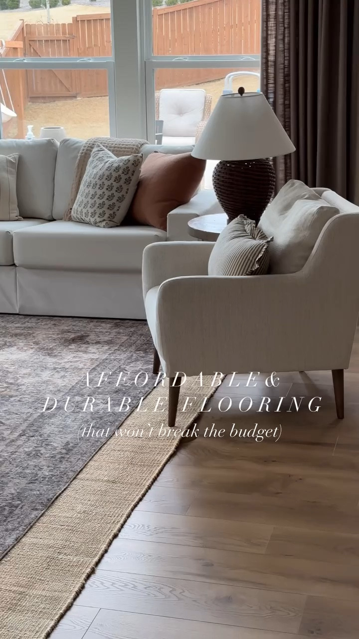Finally able to fully reveal our new flooring by @officialselectsurfaces 🤩 #sponsored 

Our builder grade flooring was not holding up and truthfully never fit the aesthetic we were going for. Back in November we had the Victoria Laminate flooring installed and I couldn’t love it more! 

Not only is this such an affordable product, but it’s perfect for our high traffic home with the highest traffic rating available. It is fully waterproof and comes with a limited lifetime warranty, making it the perfect choice for our family! I will have the exact flooring we used linked in my stories and LTK! 

#laminateflooring #affordableflooring #flooringoptions #flooringideas #flooringdesign #flooringinspiration #flooringinspo #flooringtrends
