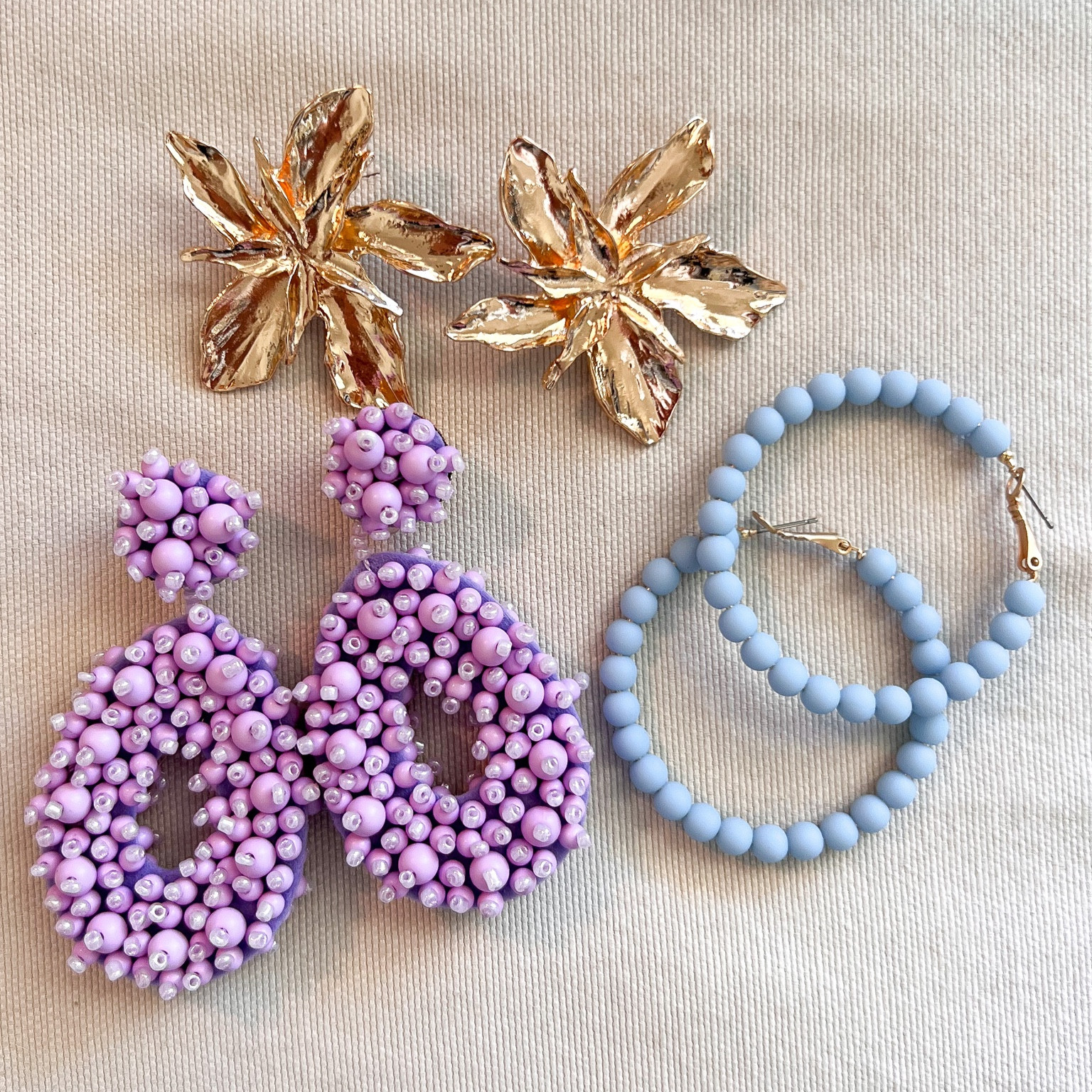 Summer earring finds! The blue hoops are super lightweight, beaded purple option are lightweight and come in so many beautiful colors and the flowers add a beautiful feminine touch to any outfit !

#LTKstyletip #LTKunder50 #LTKFind