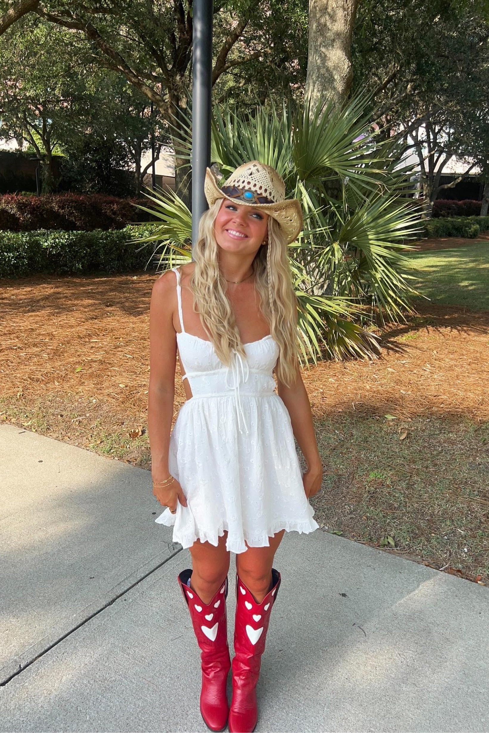 Dress is from @shopcolorfulnatalie on IG! Use code “CNTORREB” for $$ off! Country concert outfit, red cowboy boots, red cowgirl boots, summer concert outfit, country outfit, western outfit, white dress for concert, summer concert outfit, summer style, western style, country girl, country style